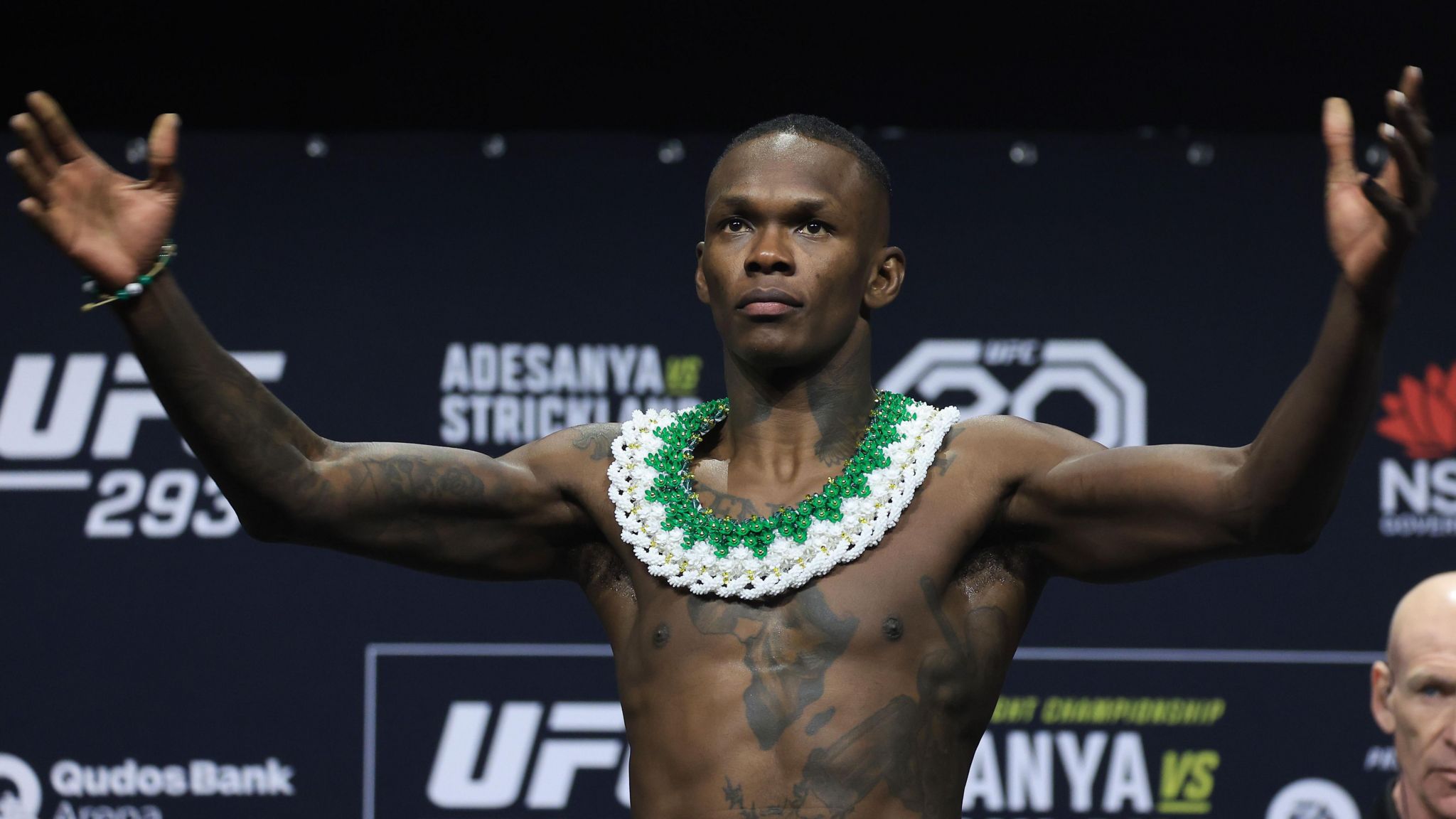 Israel Adesanya poses at a weigh-in ahead of UFC 293