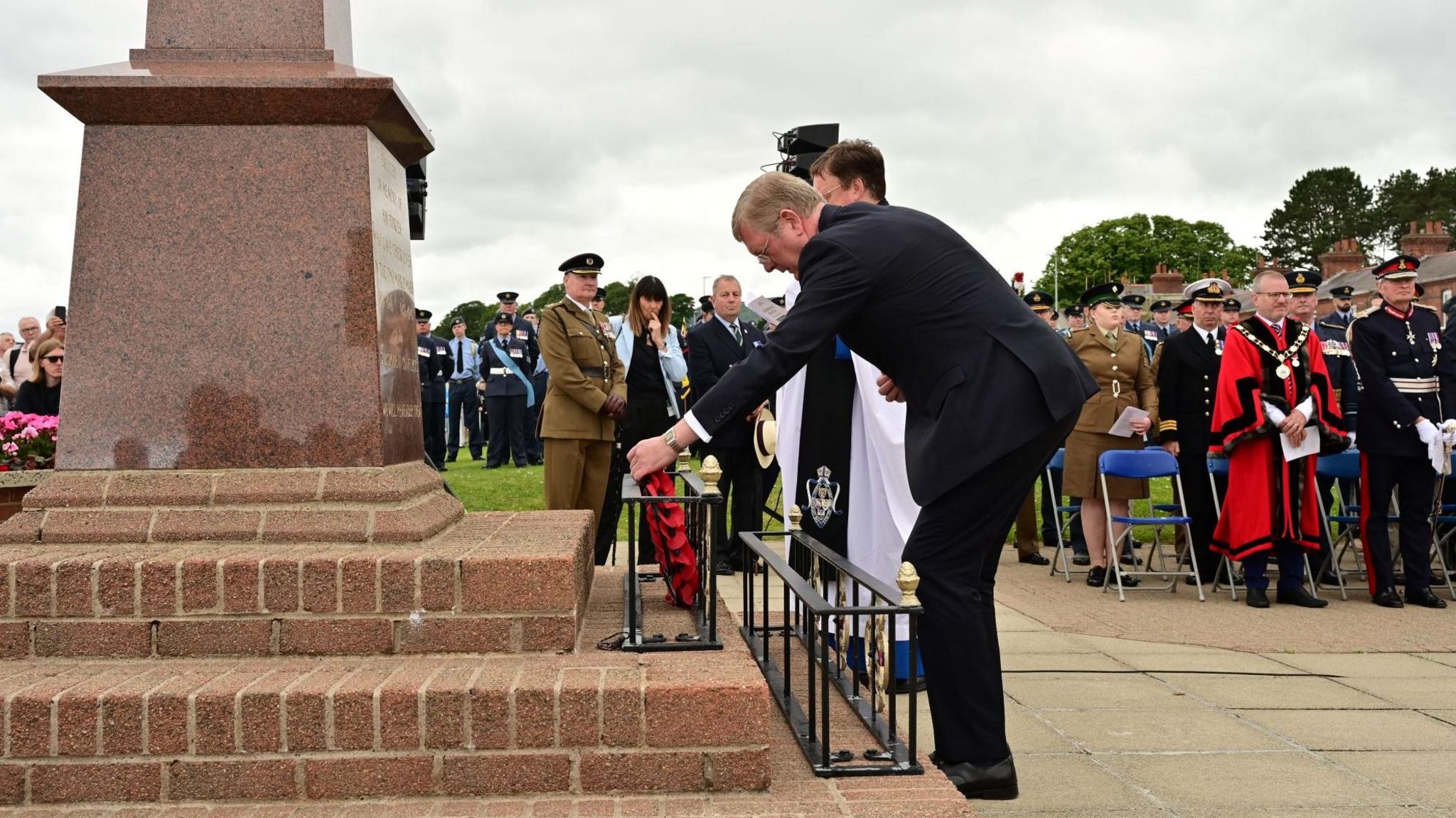 Lord Caine Parliamentary Under-Secretary of State for Northern Ireland lays a wreath in honour of the sacrifice of all involved in D-Day