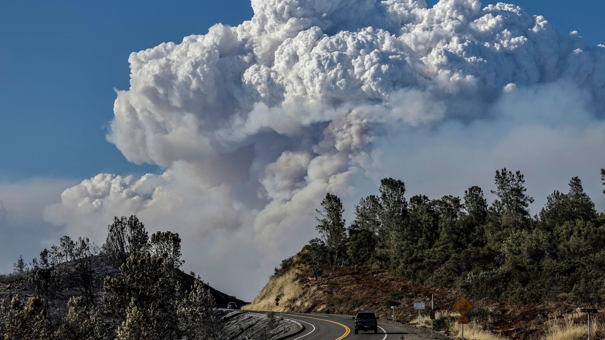 A smoke plume from the Park Fire