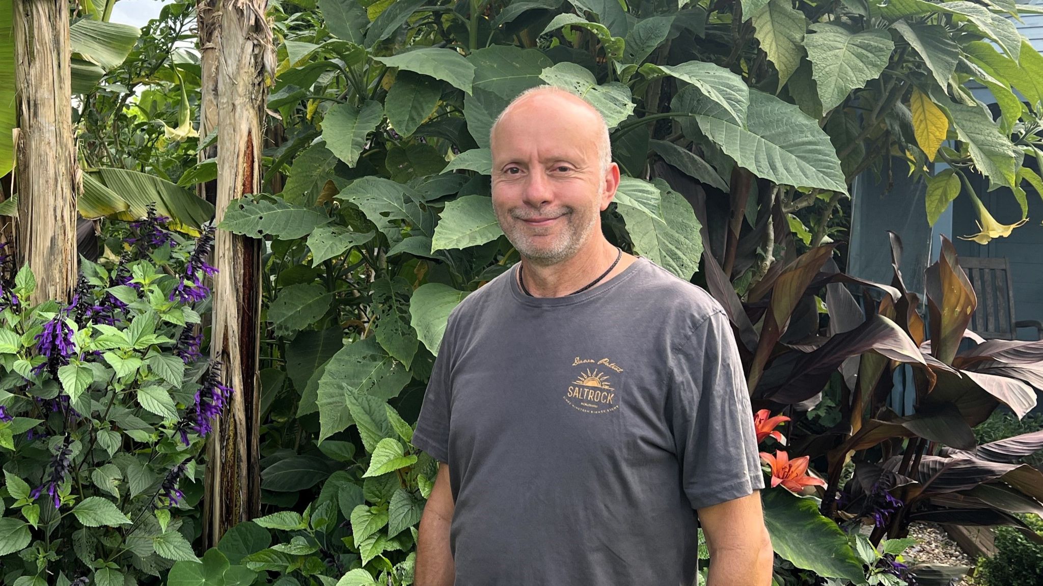 A head and shoulders photo of Tony Gasparro standing in his garden