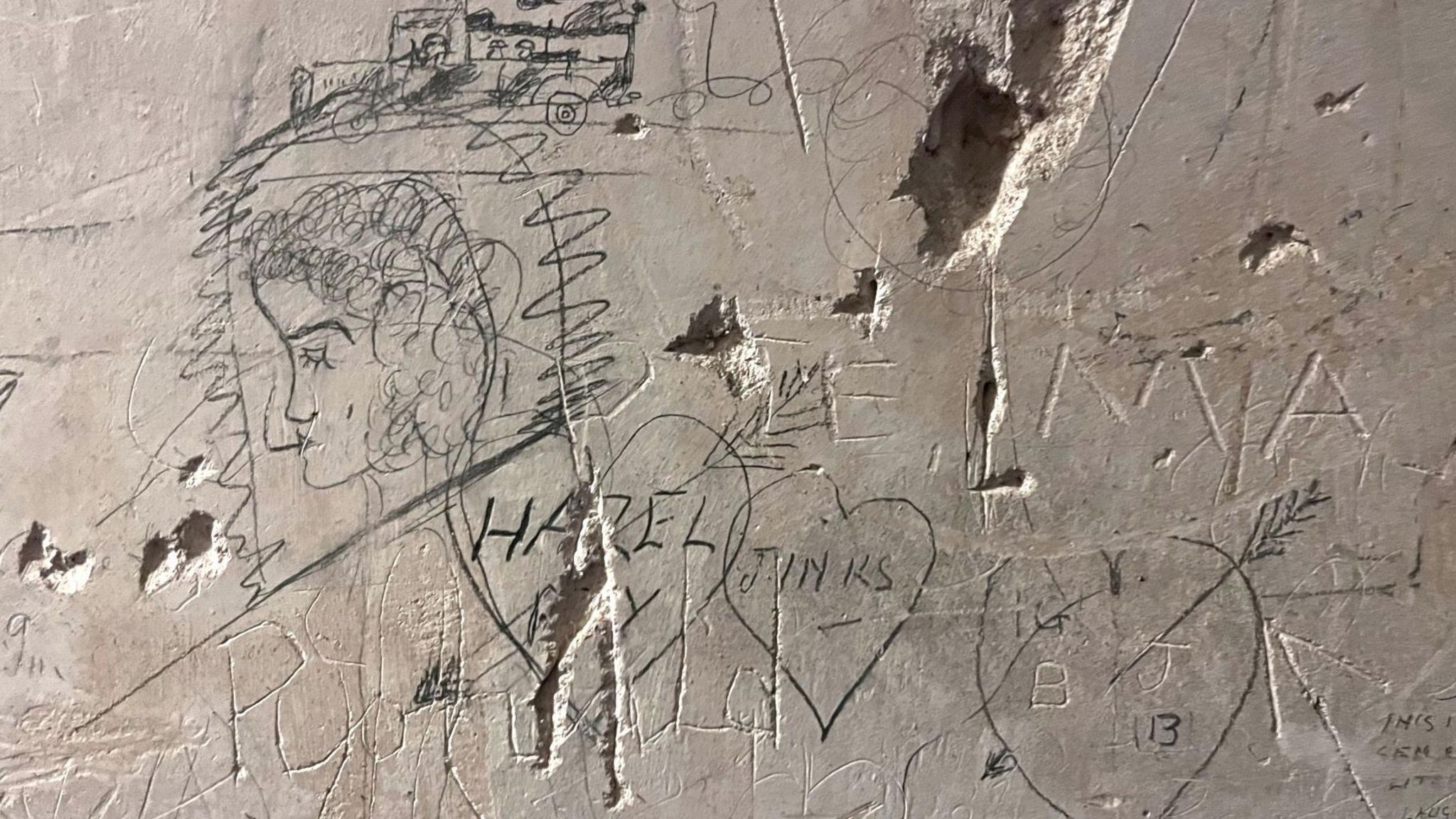 Some of the writing and drawings from the American soldiers that can be found on the walls of Killymoon Castle