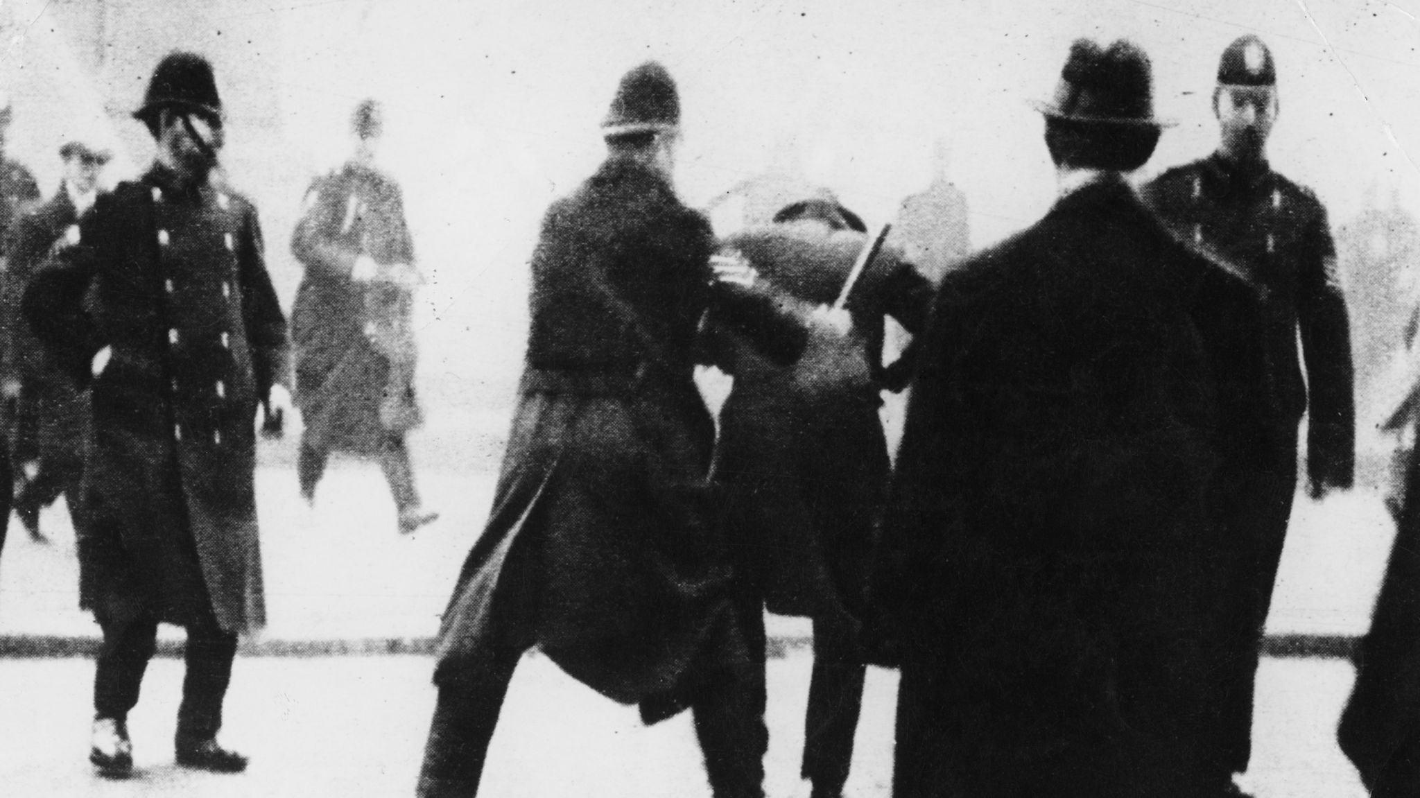 A police officer uses his baton on a striker in Glasgow during Bloody Friday