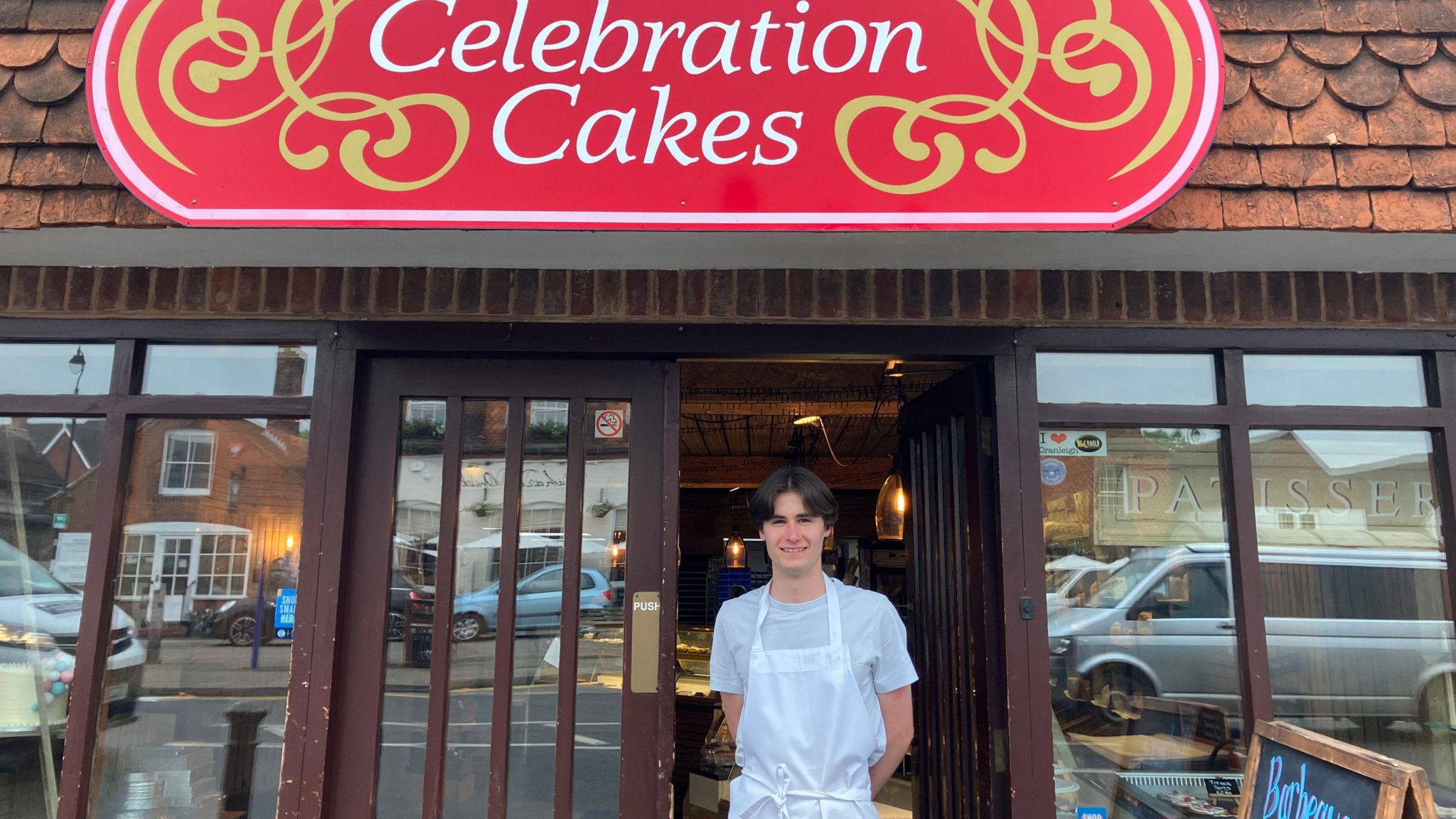 Curtis outside Celebration Cakes in Cranleigh