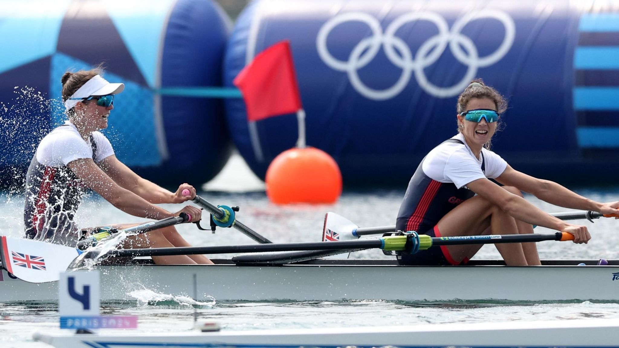 Imogen Grant and Emily Craig in a rowing boat during a race 