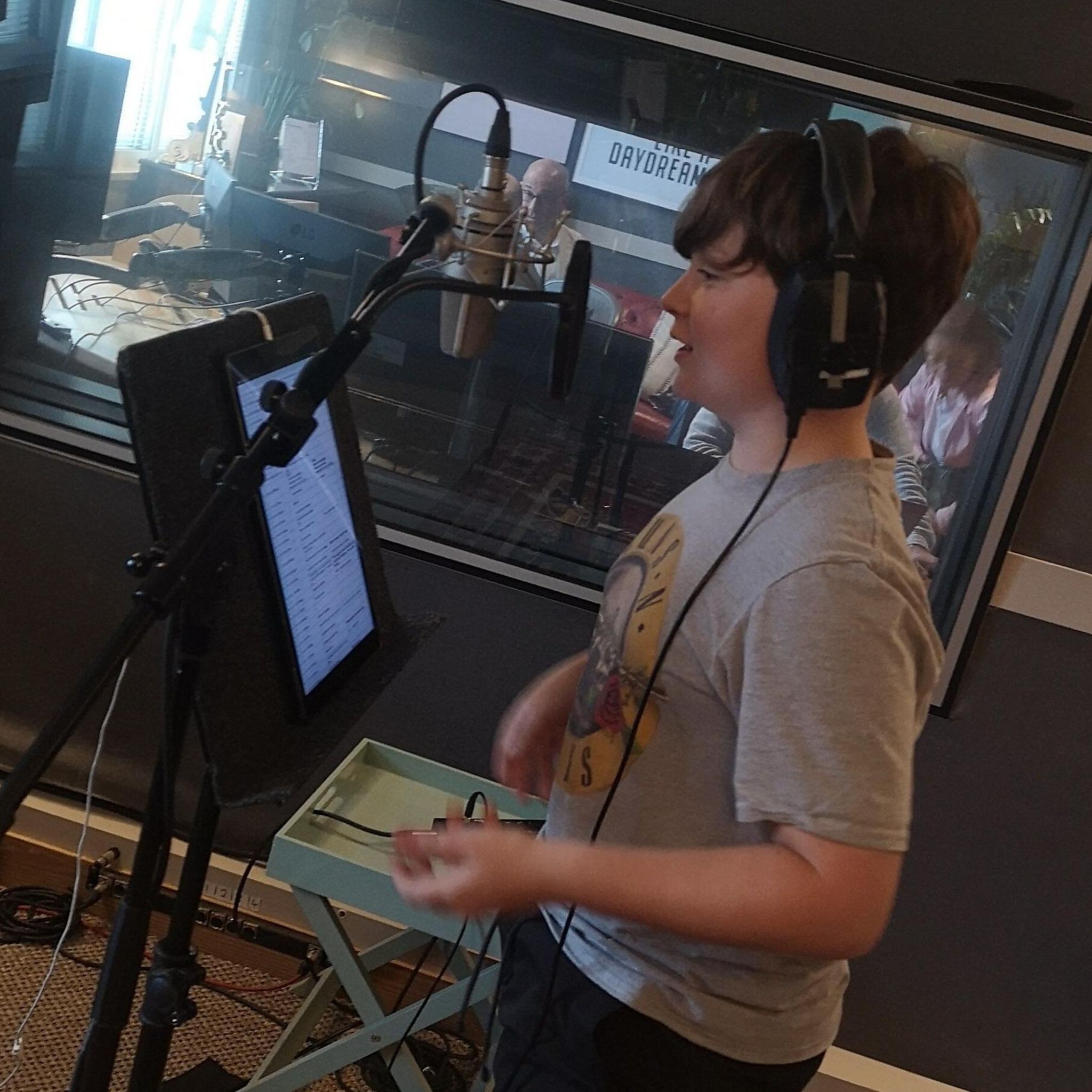 Louie Rudge-Buchanan recording his lines in a studio