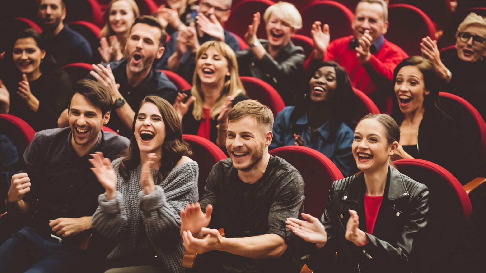 People laughing at a comedy club