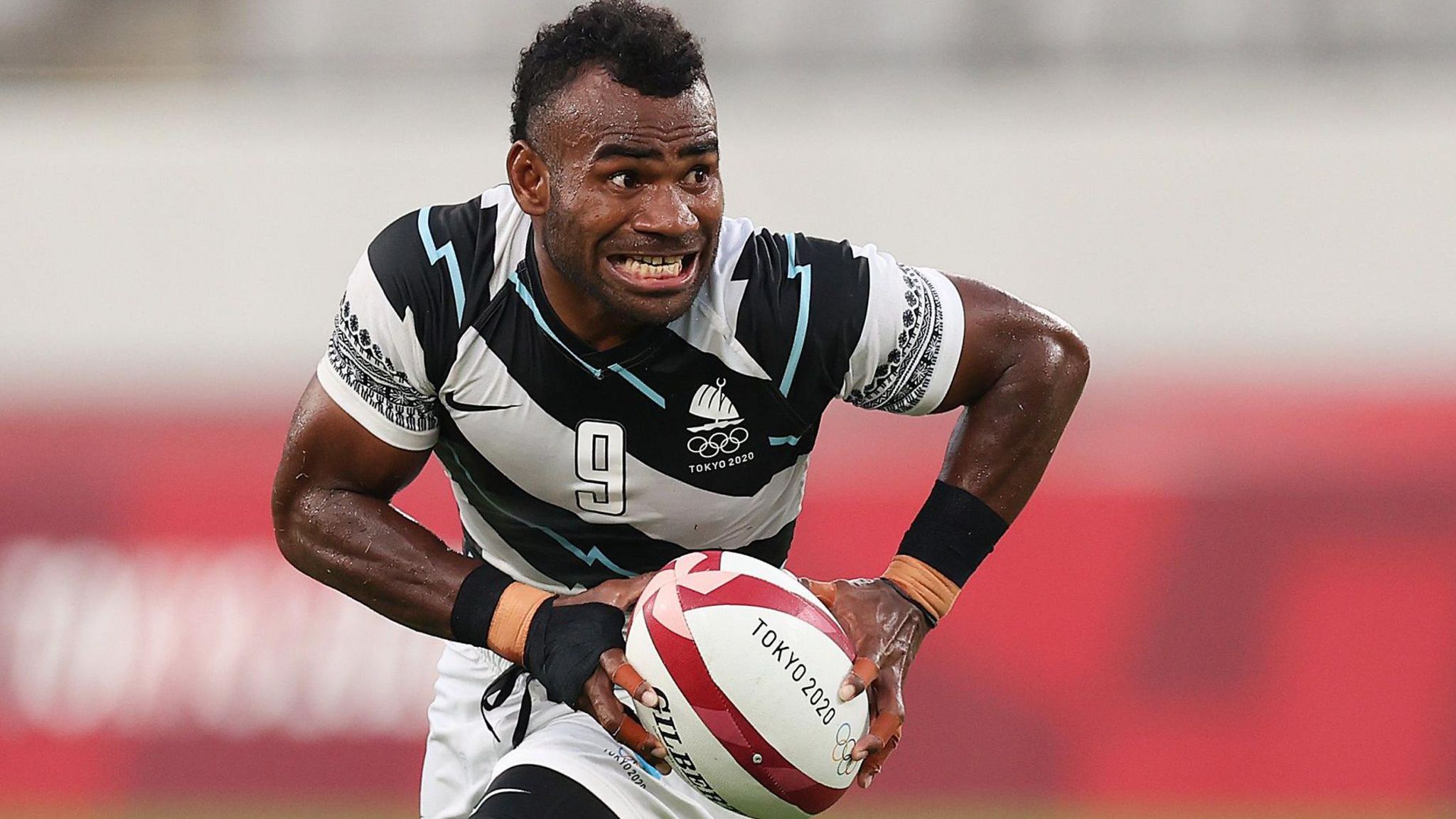 Jerry Tuwai carries the ball forward for Fiji at the Tokyo 2020 Olympics