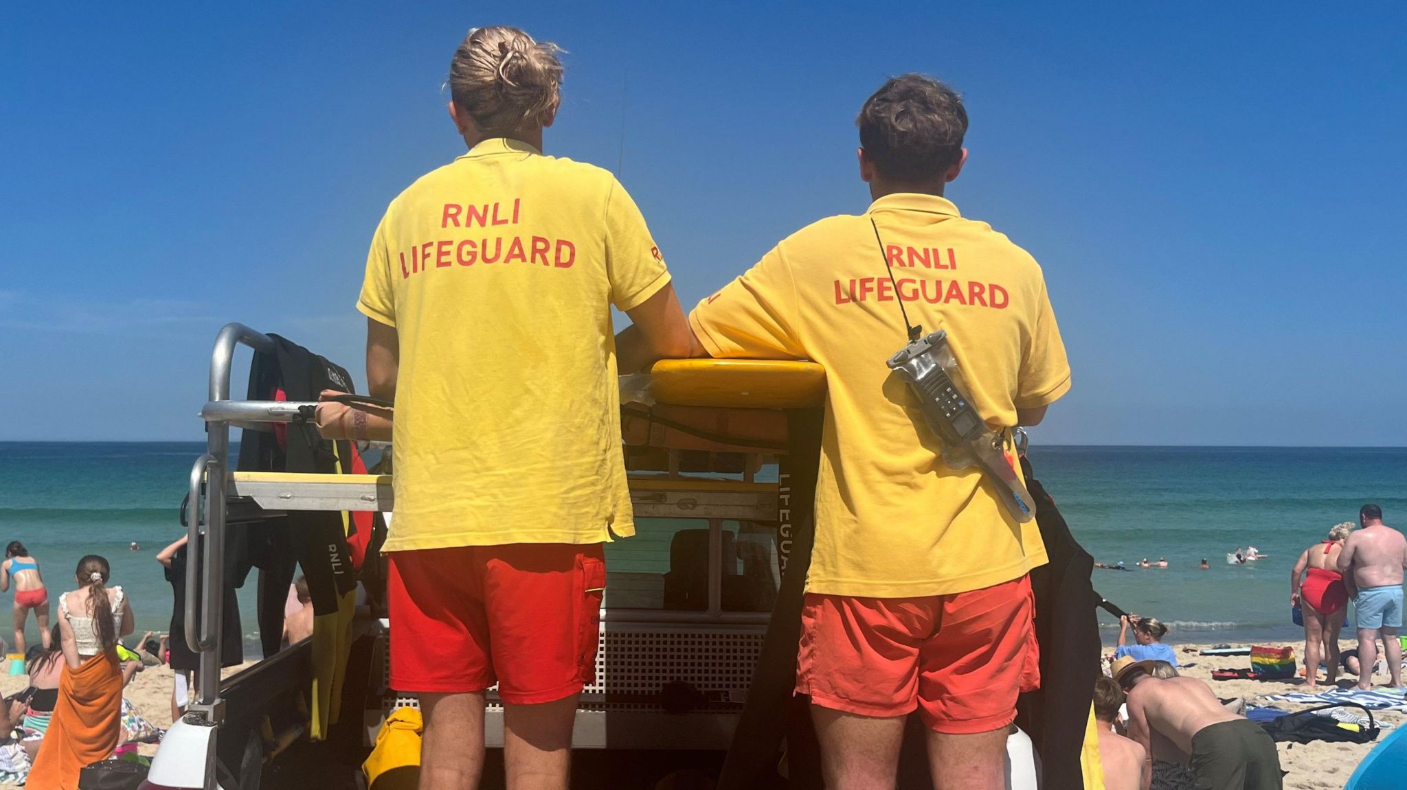 RNLI Lifeguards looking out to sea