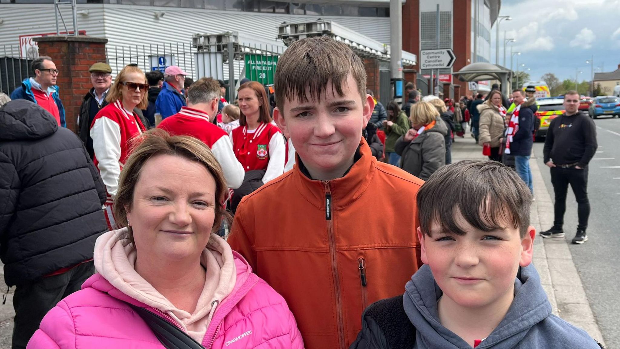 Supporters Delyth Owen, Morgan, 16, and Dyfan, 11, go to home and away games