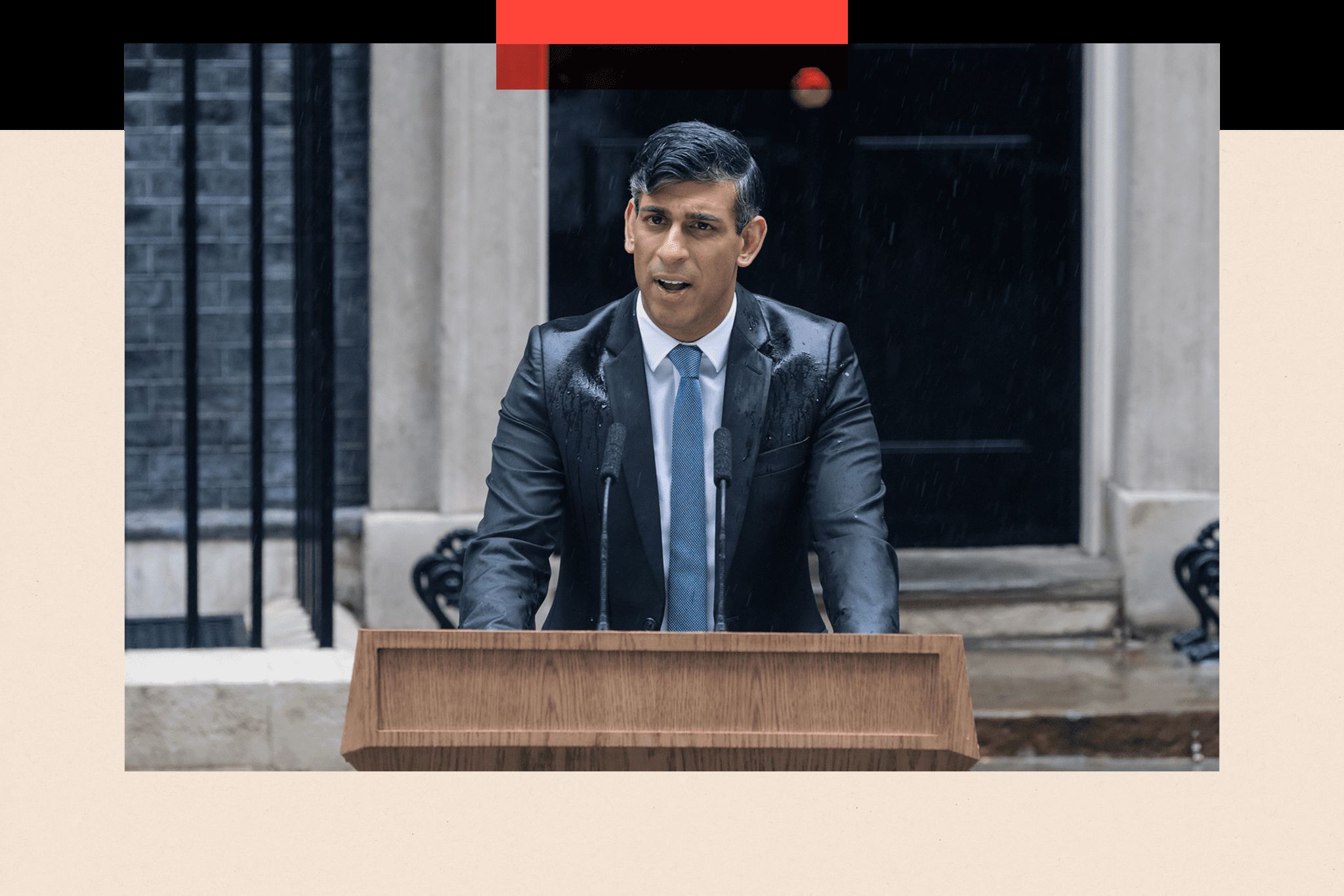 Rishi Sunak speaking at a lectern in a drenched suit in front of number 10 Downing Street