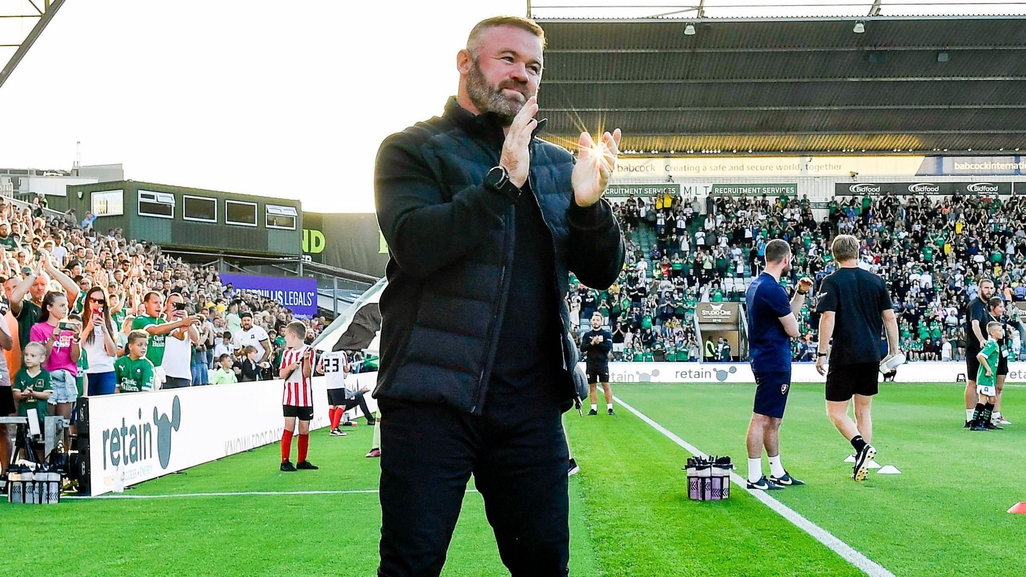 Wayne Rooney applauds the Plymouth Argyle crowd