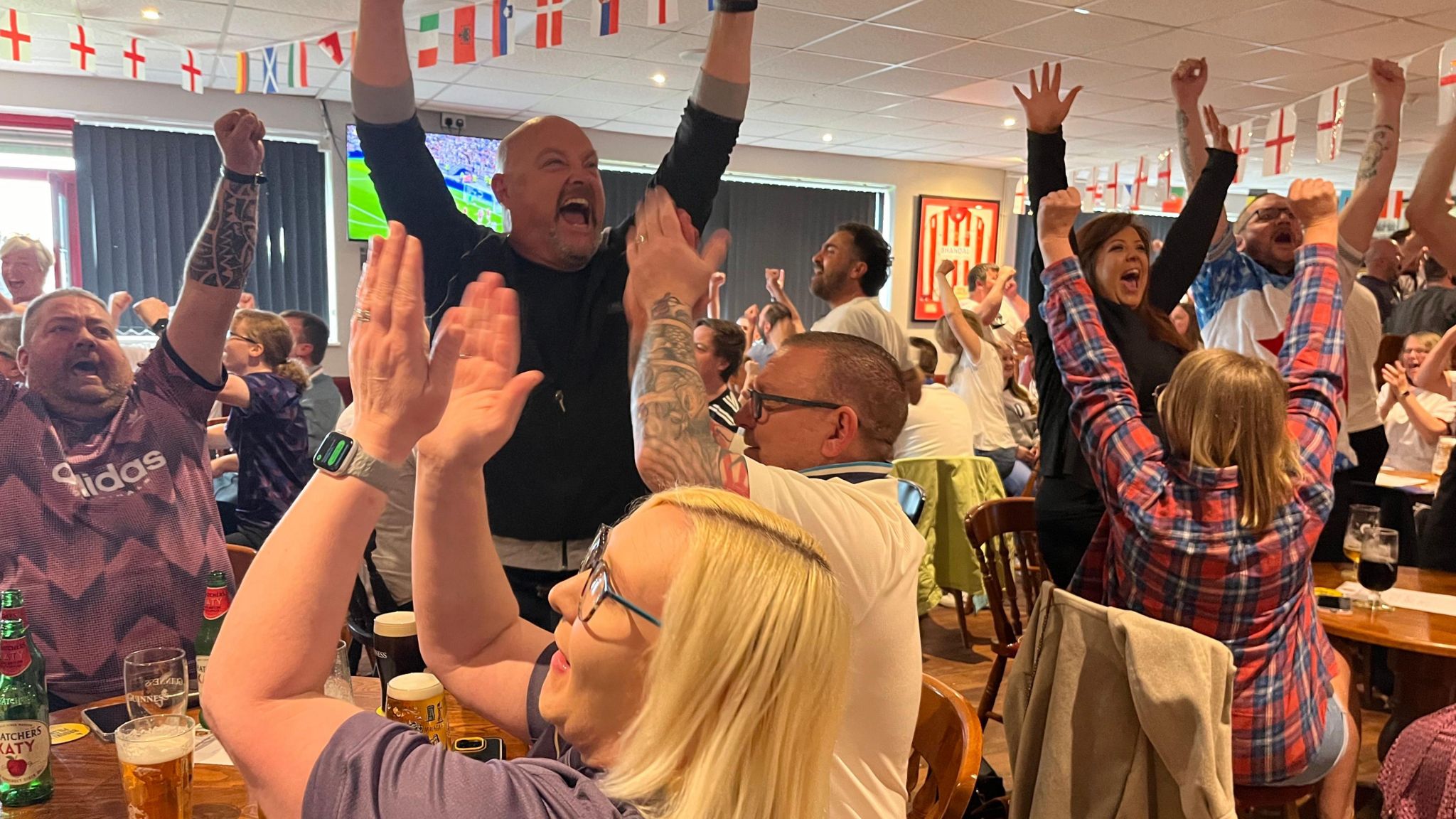 Crowds cheering at Stourbridge FC clubhouse