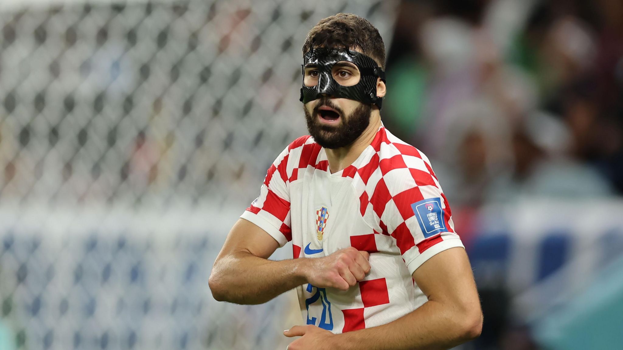 Manchester City and Croatia defender Josko Gvardiol wearing a protective mask in the round of sixteen against Japan at the Qatar World Cup.