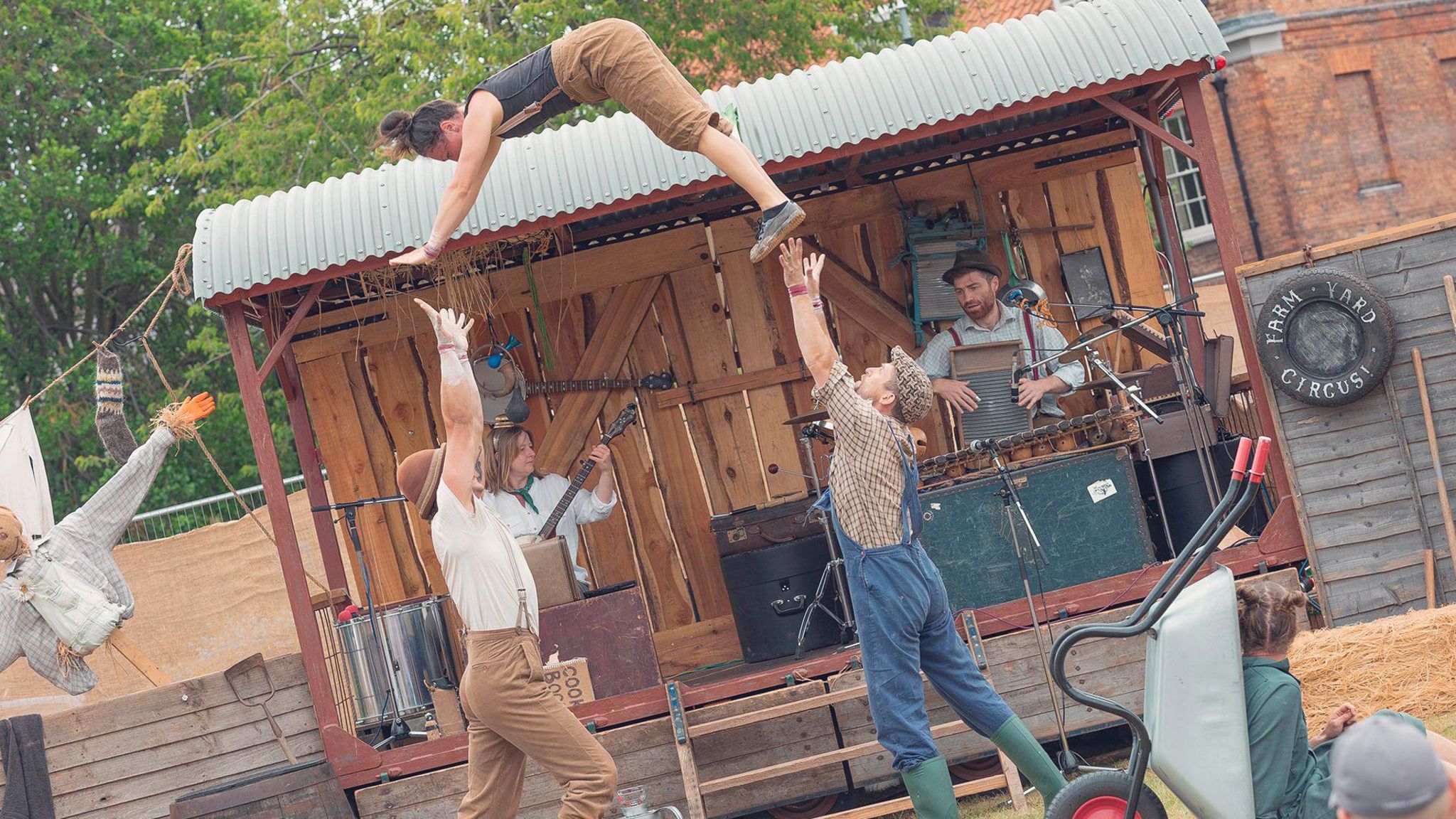 Three people perform acrobatics at the GO festival