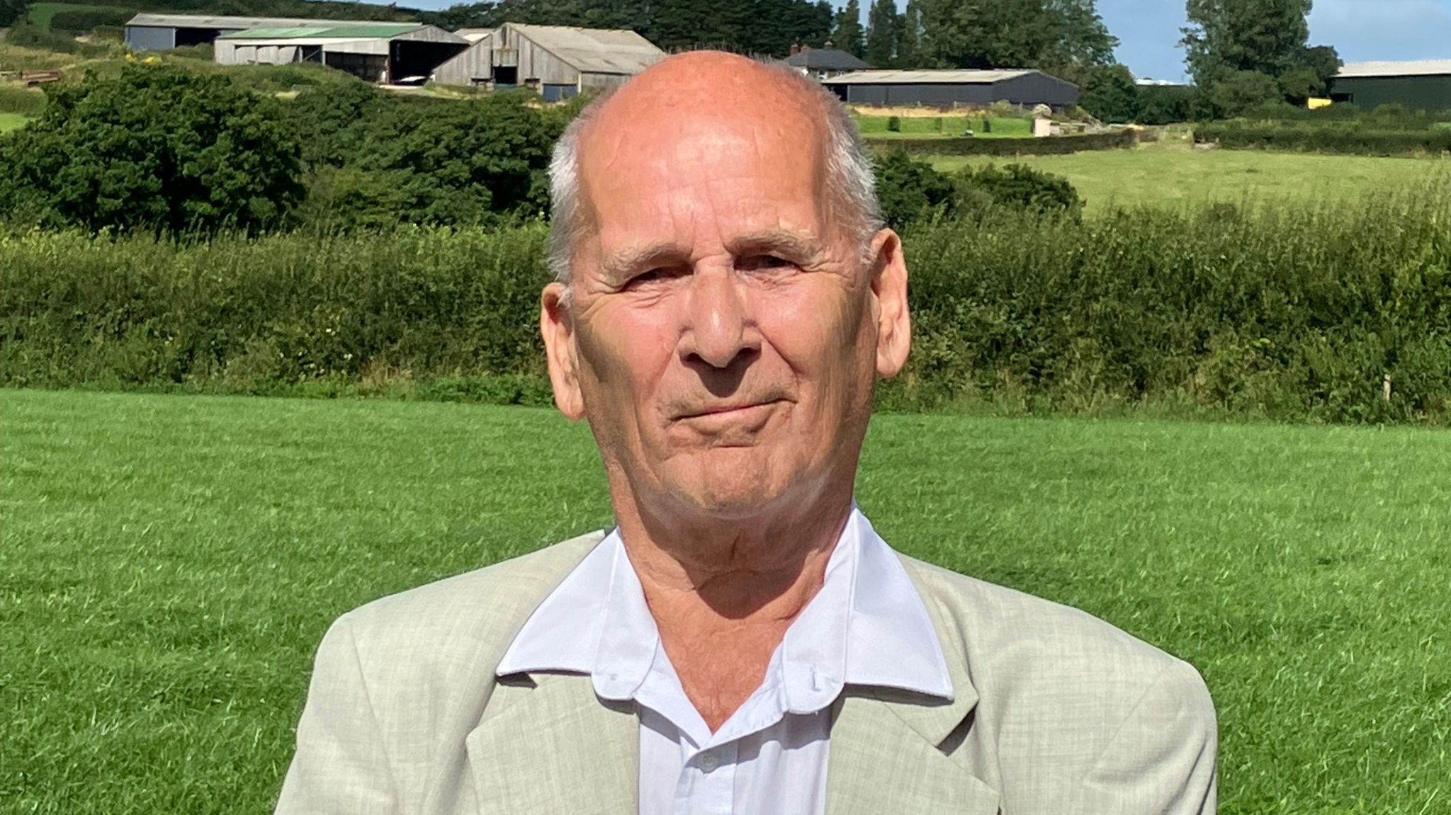 Man in front of fields