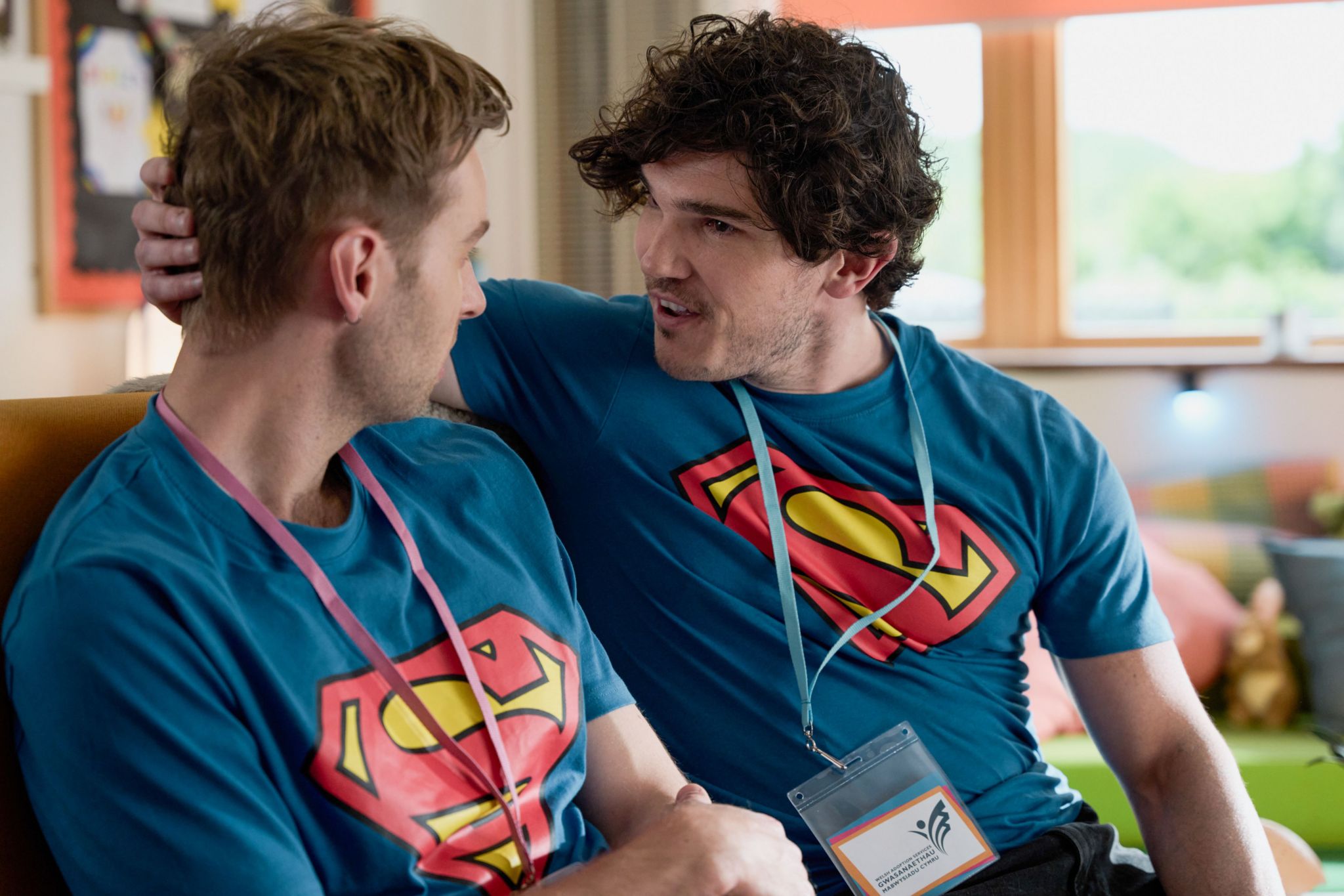 Gabriel (left) and Andy (right) are wearing blue t-shirts with the Superman logos on, and they're facing one another.