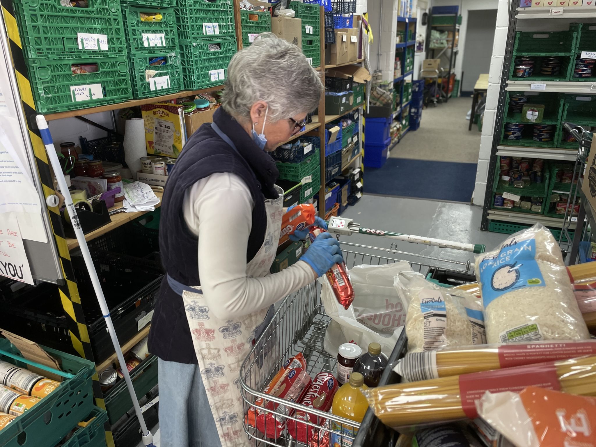 A woman sorting out food at a Suffolk charity 