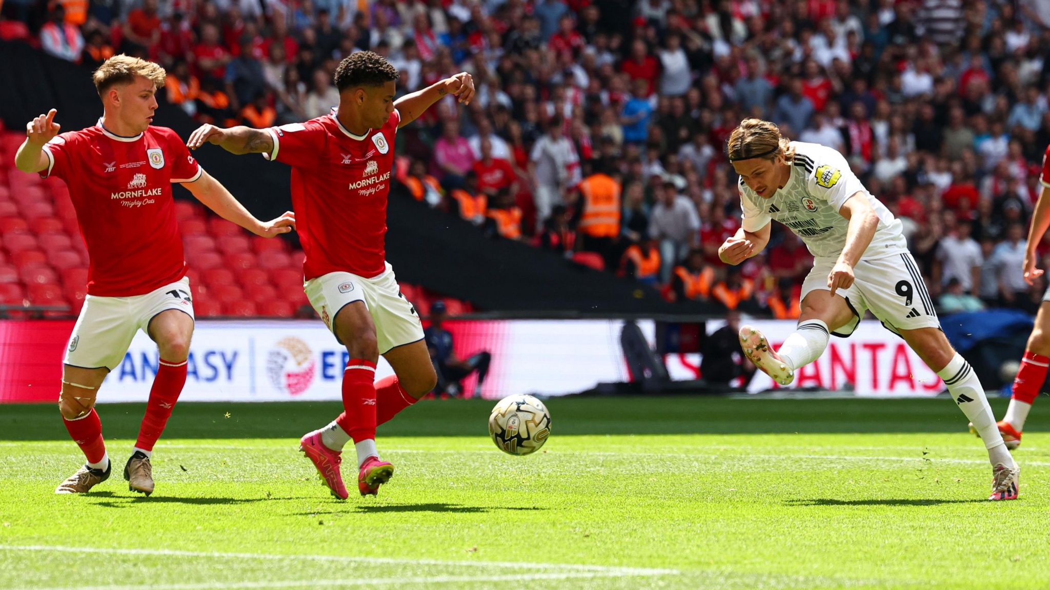 Danilo Orsi bends the ball with the outside of his boot into the bottom corner to give Crawley the lead