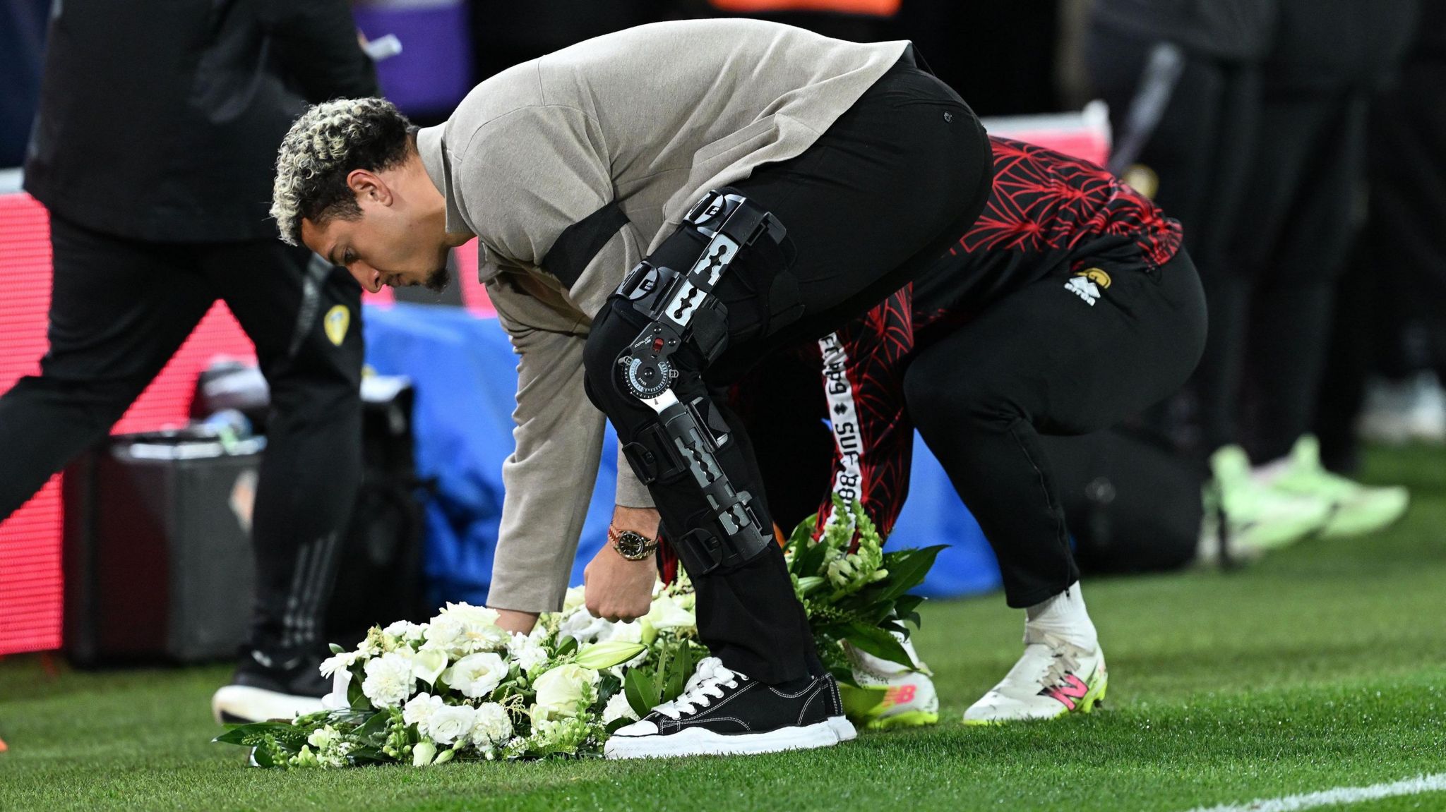 Injured Leeds united captain Ethan Ampadu - a former Sheffield United teammate of Baldock's - lays a floral tribute in his memory