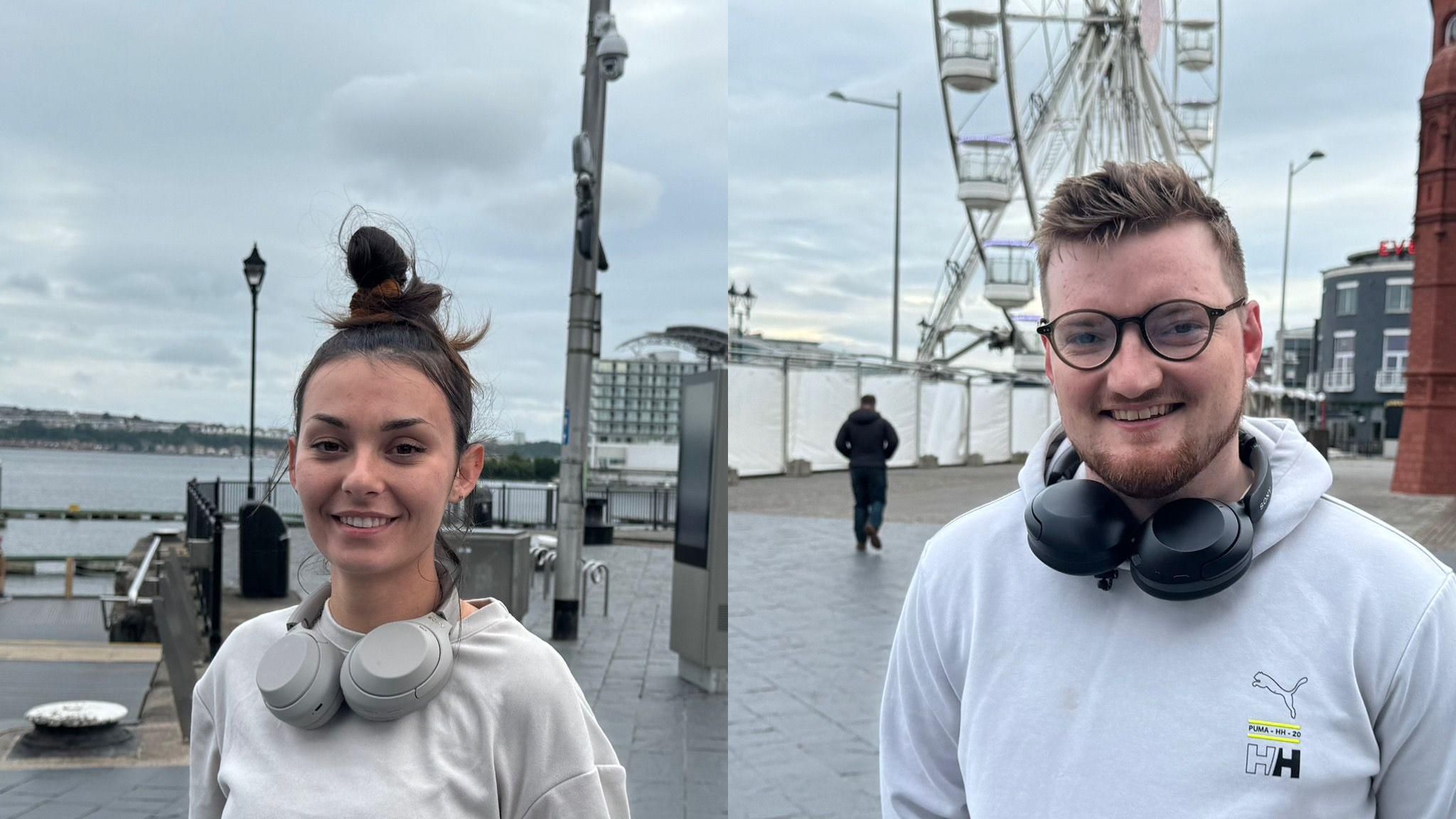 Lucy Jones, a female, and Will Harris, a male, smiling at the camera out in Cardiff Bay. Both are wearing sports clothing and have headphones around their necks.