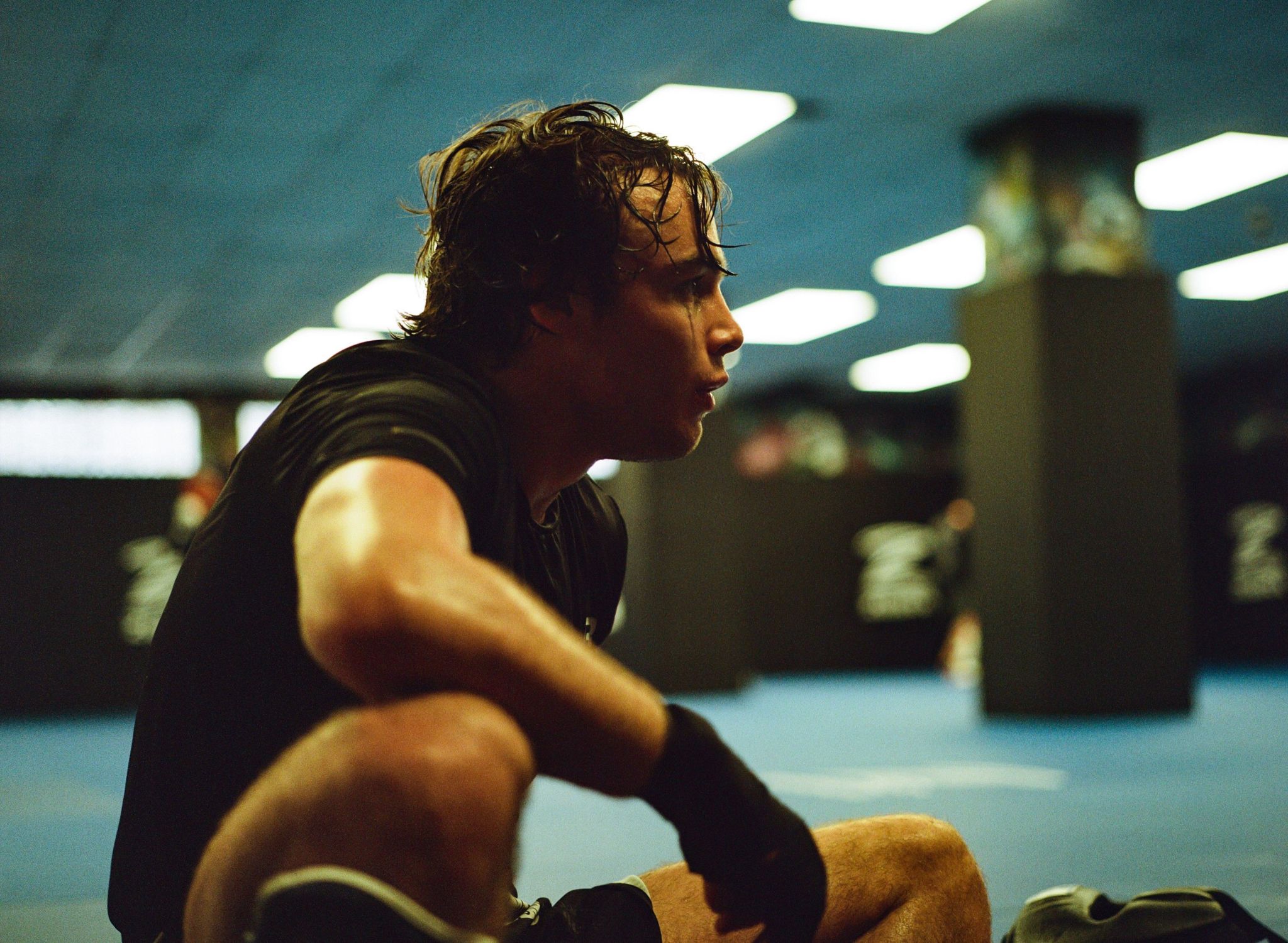 A Cage Warriors fighter sits on the mats