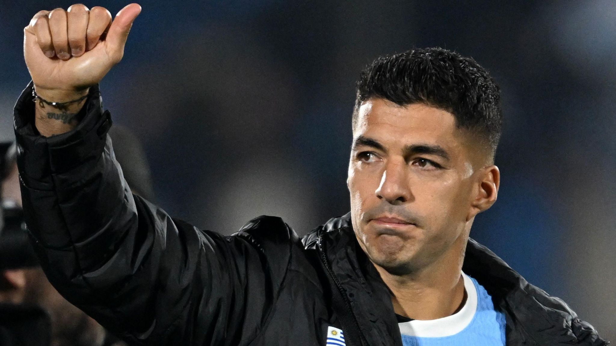 Luis Suarez waving to the crowd after his final game for Uruguay