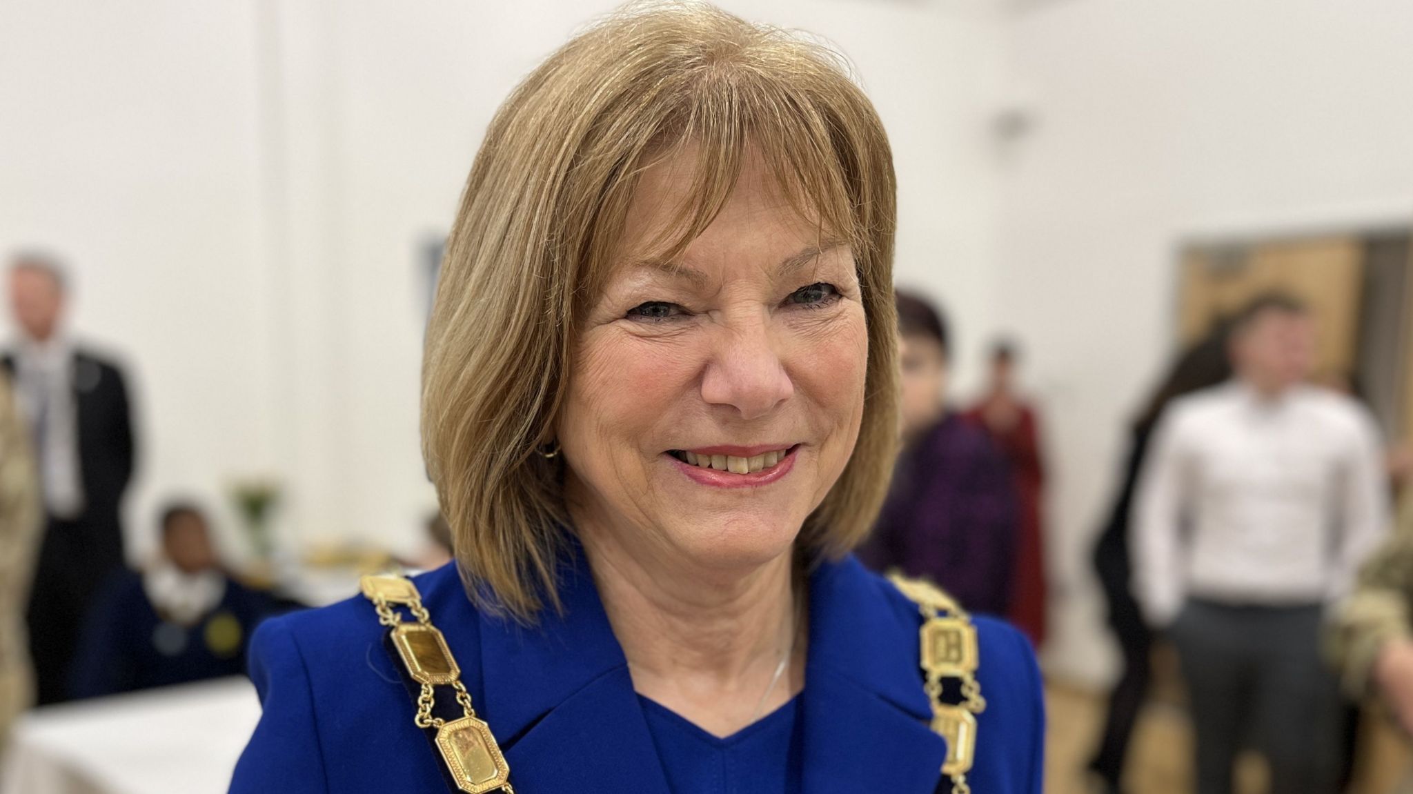 Mayor of Tidworth, Carole Webb, wearing a blue suit and the mayoral chain