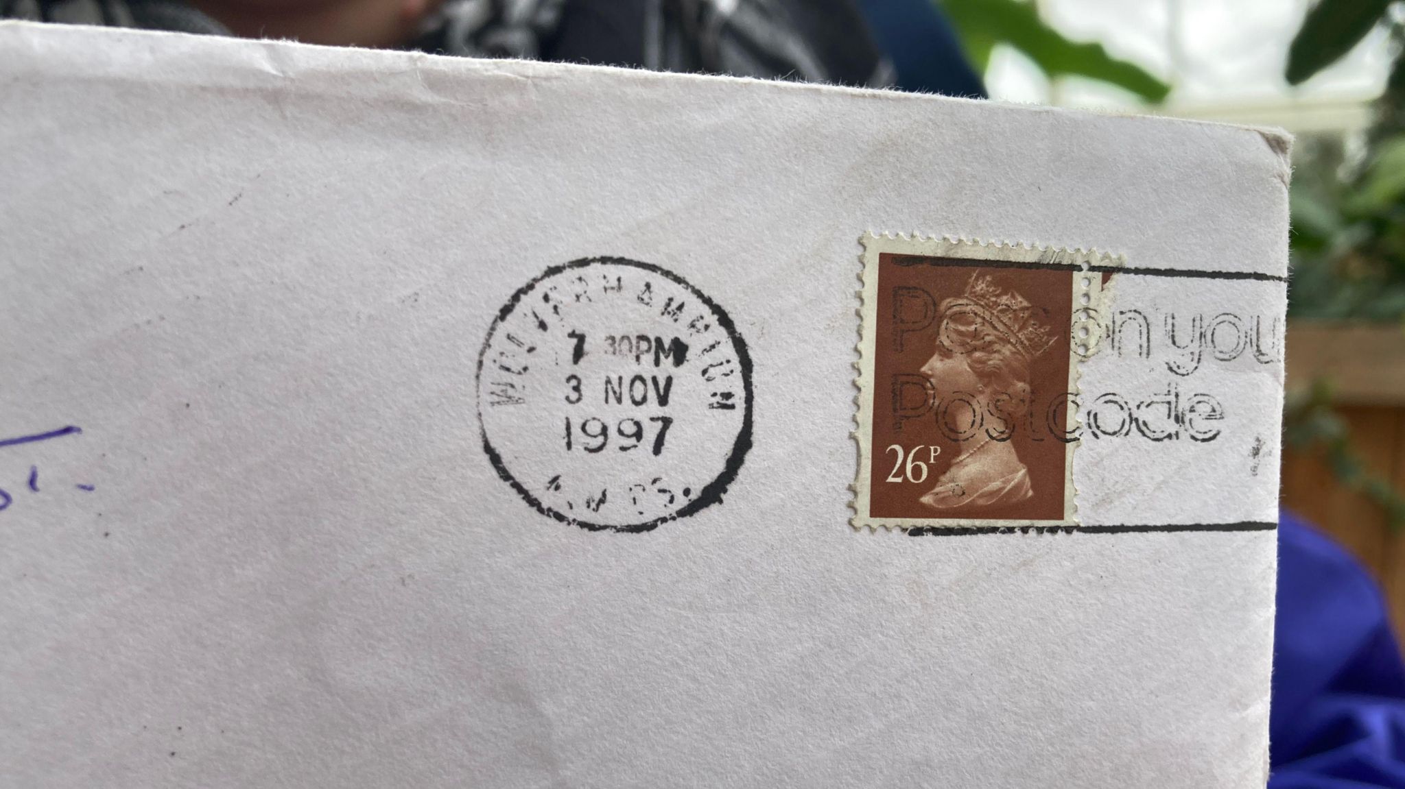 An envelope with a stamp and 1997 postmark