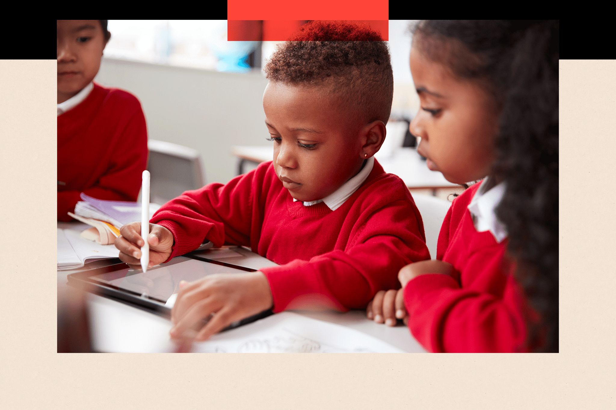 Primary school children working on a tablet