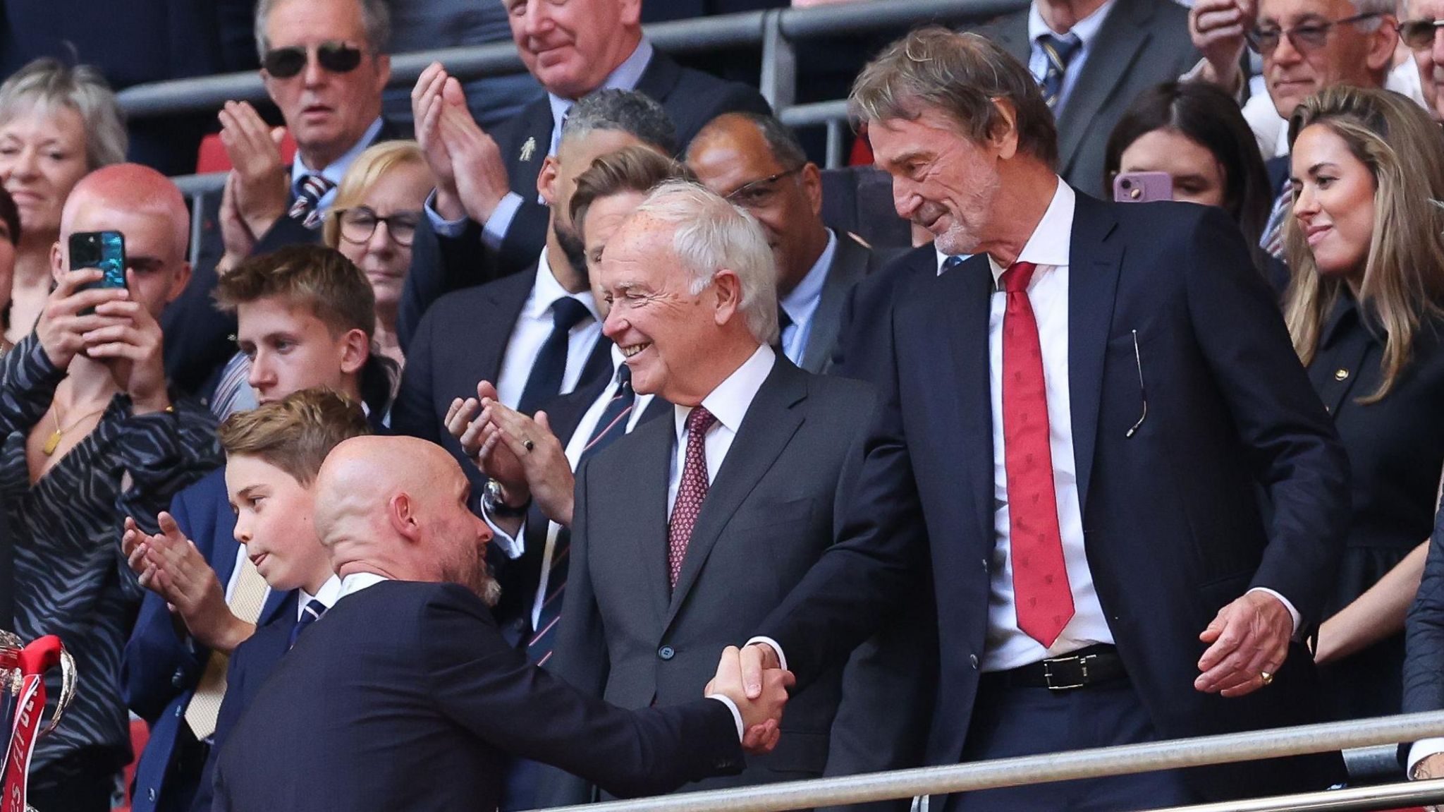 Manchester United manager Erik ten Hag shakes hands with minority owner Sir Jim Ratcliffe after the club's FA Cup win against Manchester City