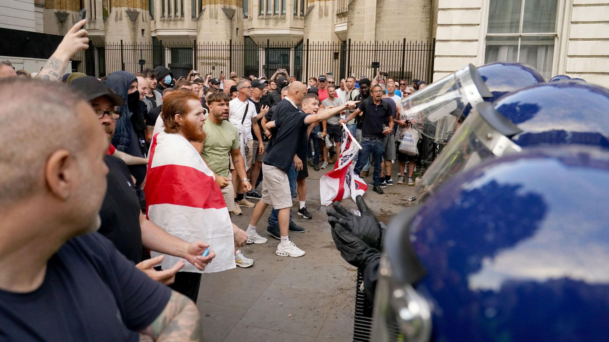 Protesters approach the police in Whitehall, London