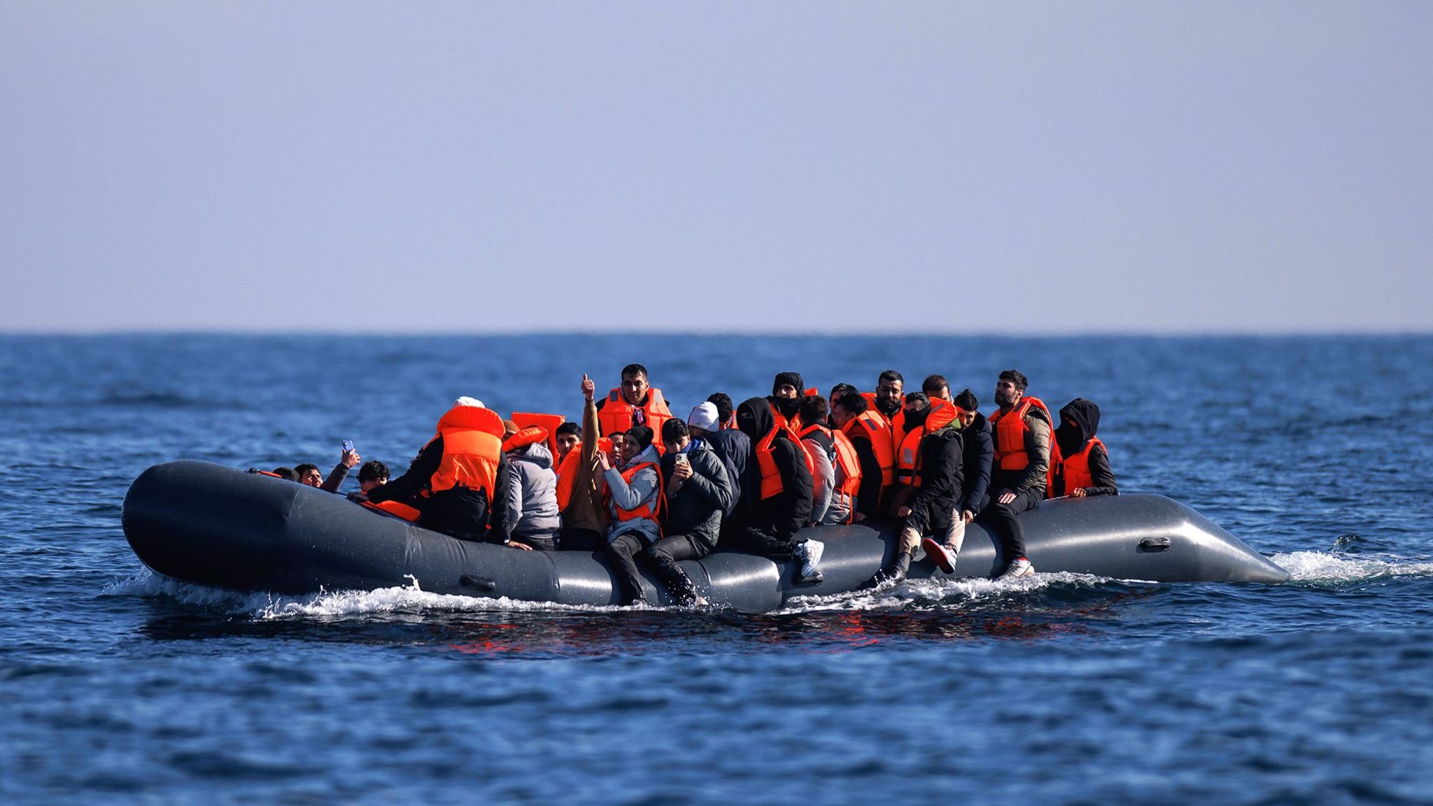 An inflatable dinghy carrying migrants crosses the English Channel, 6 March 2024