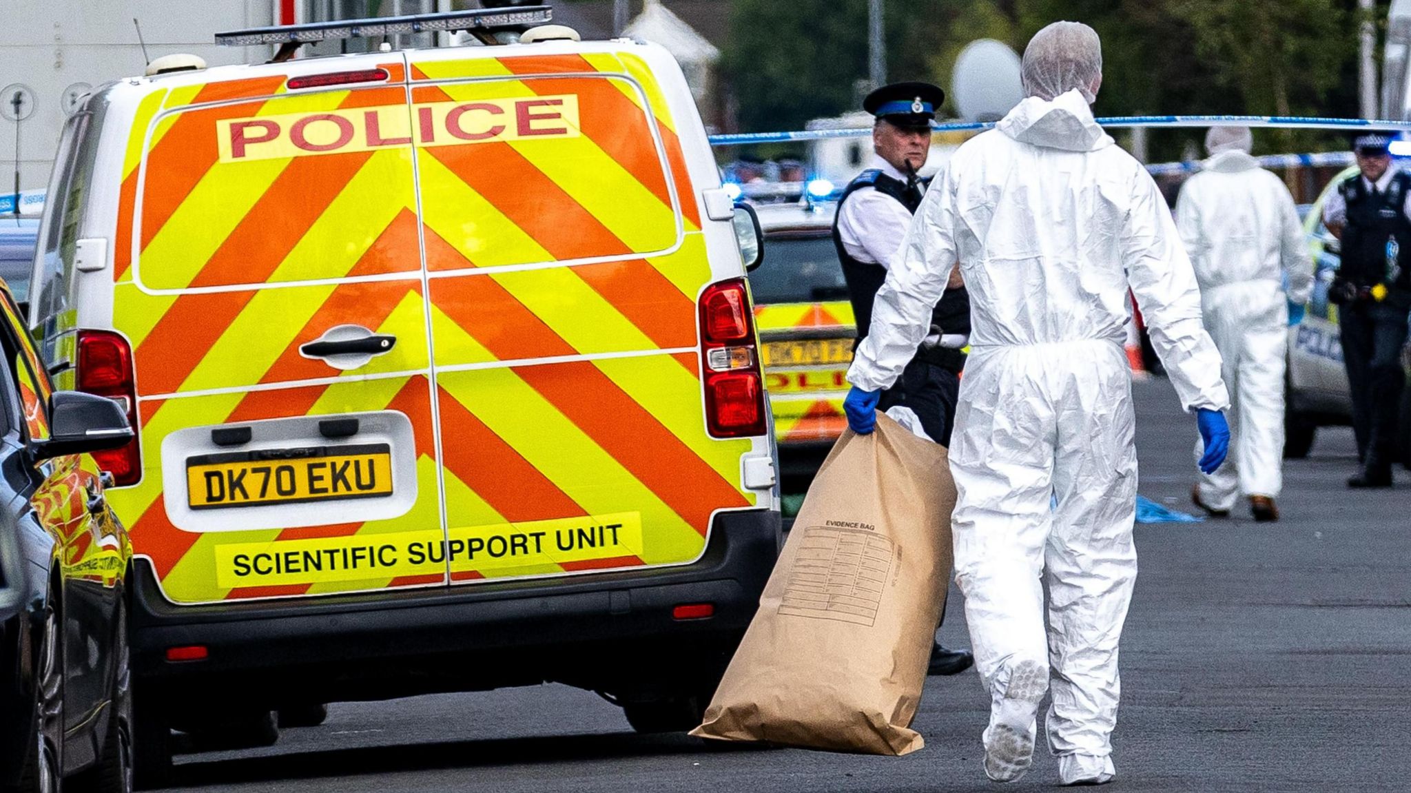 Forensic officers on Hart Street in Southport, Merseyside, where a man has been detained and a knife has been seized after a number of people were injured in a reported stabbing