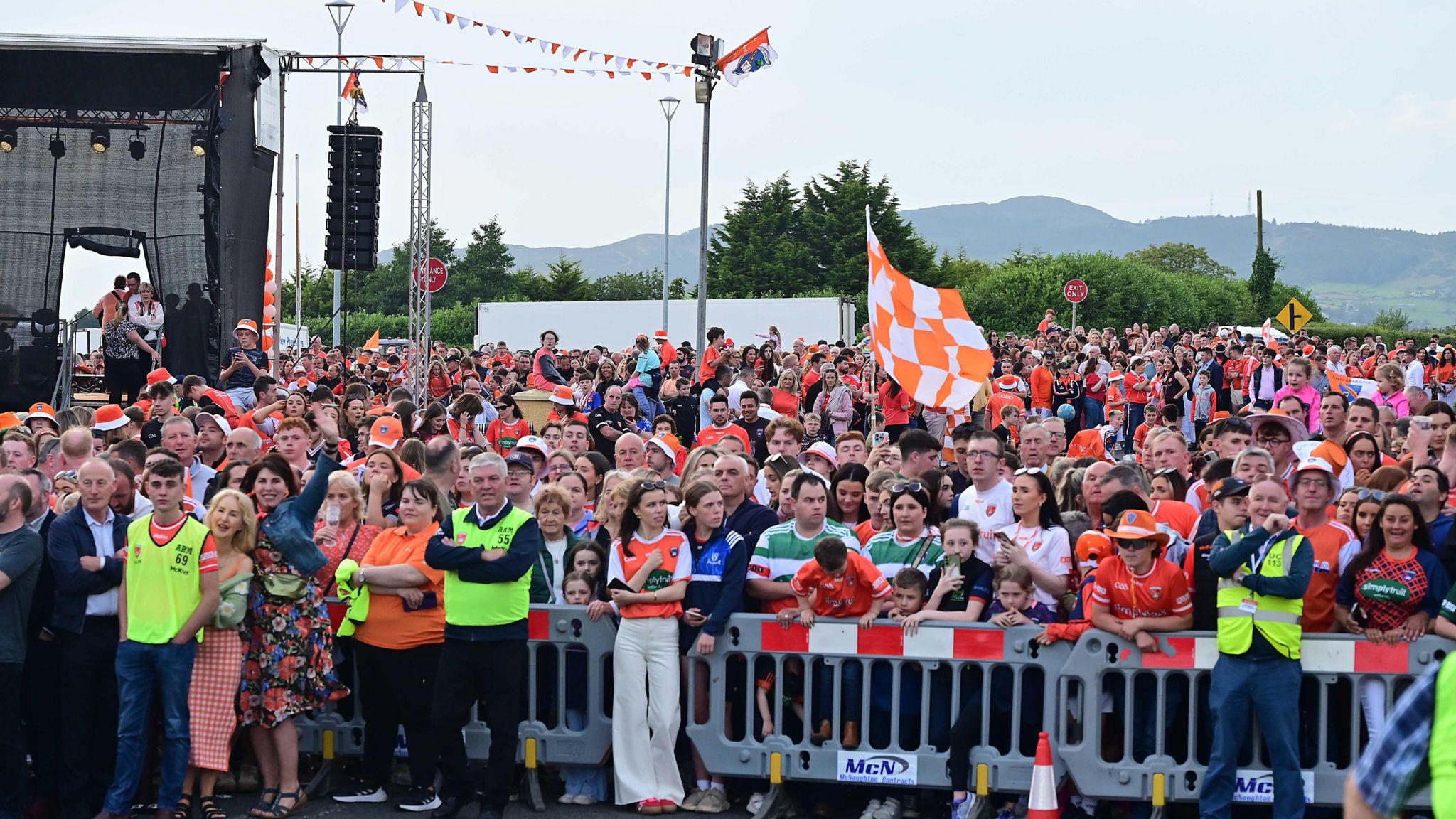 Crowds of fans standing behind barrier at Armagh's homecoming event