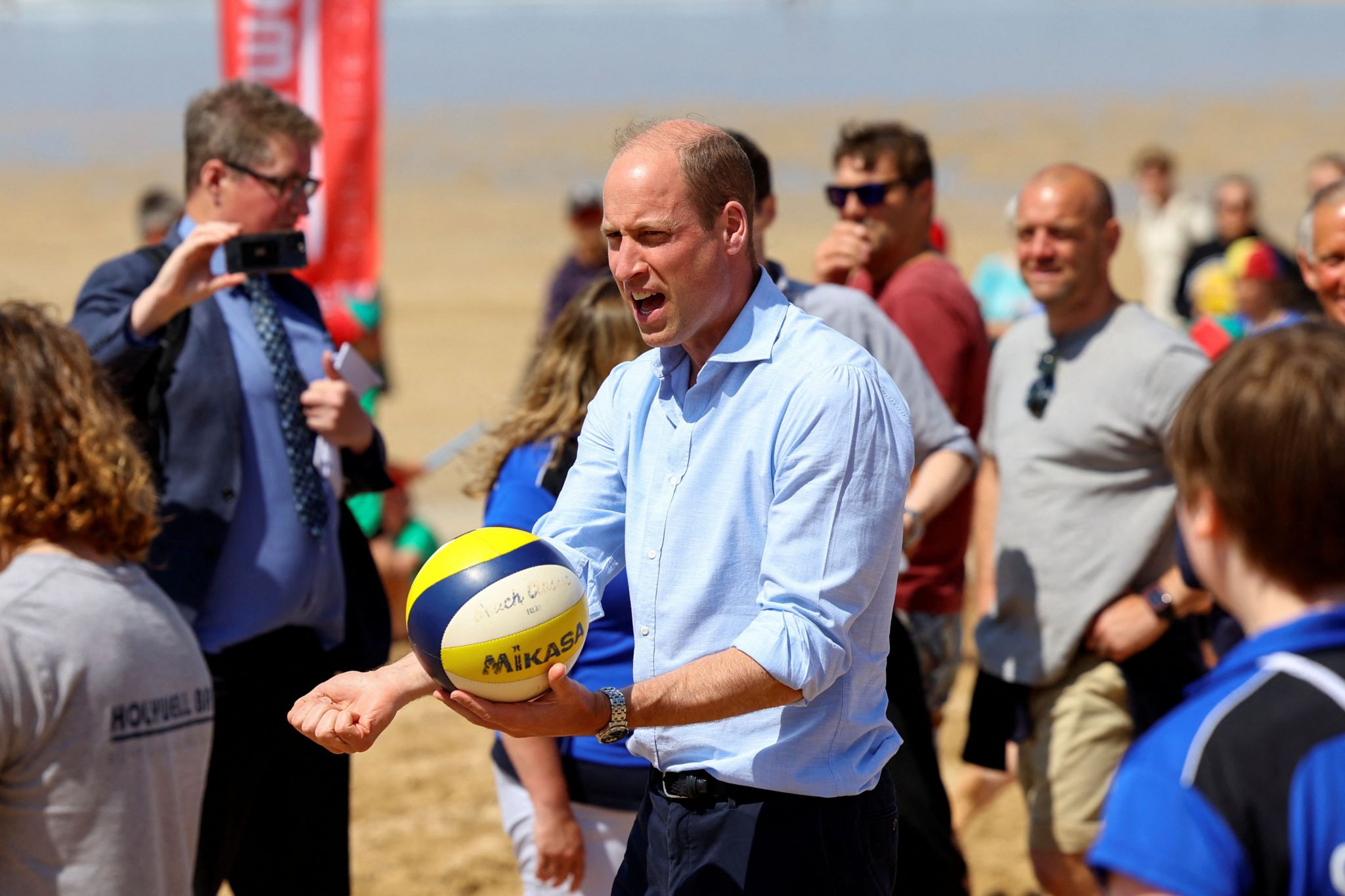 Prince William about to hit a volleyball