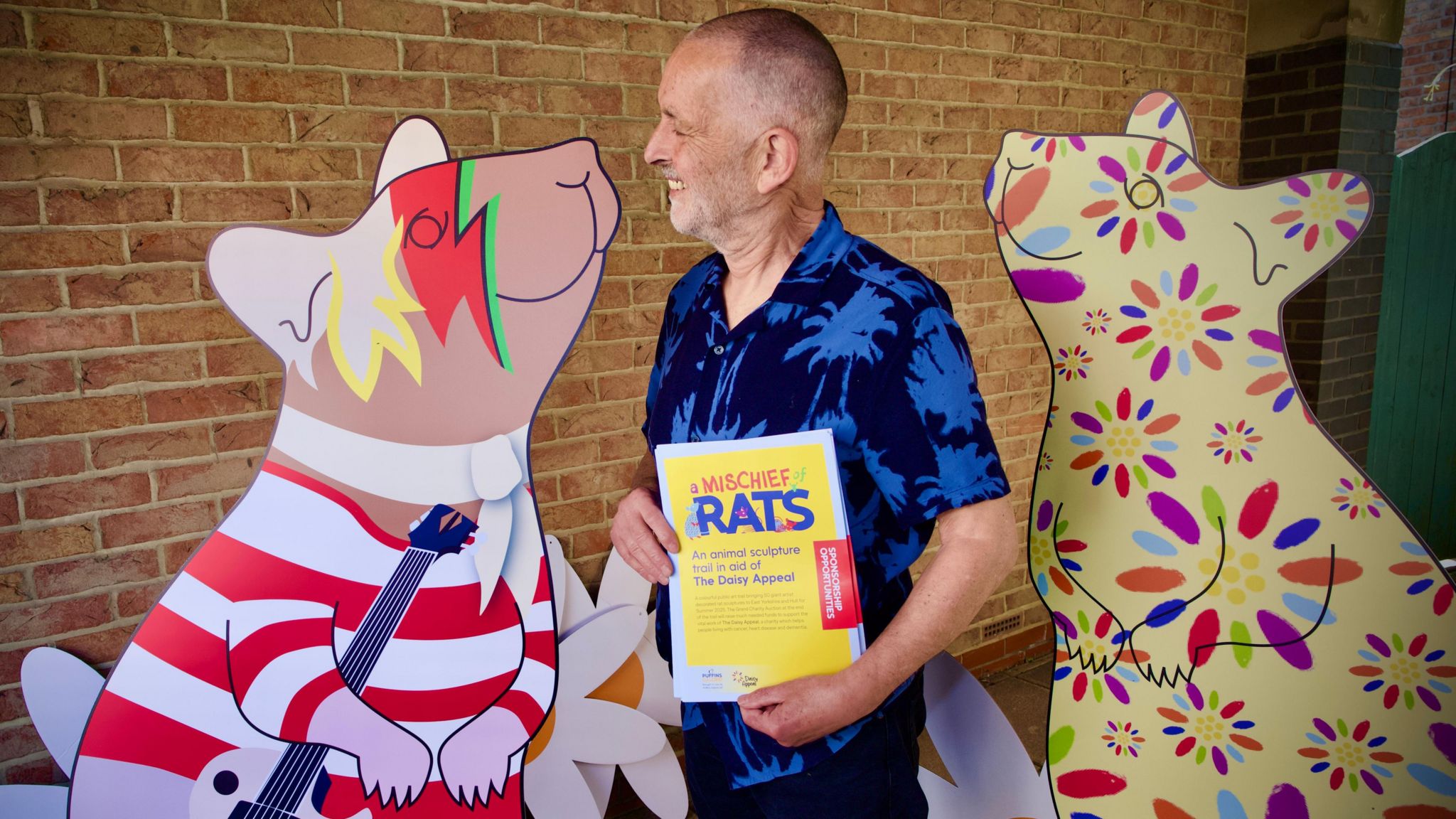 Rick Welton looking at Rat designs