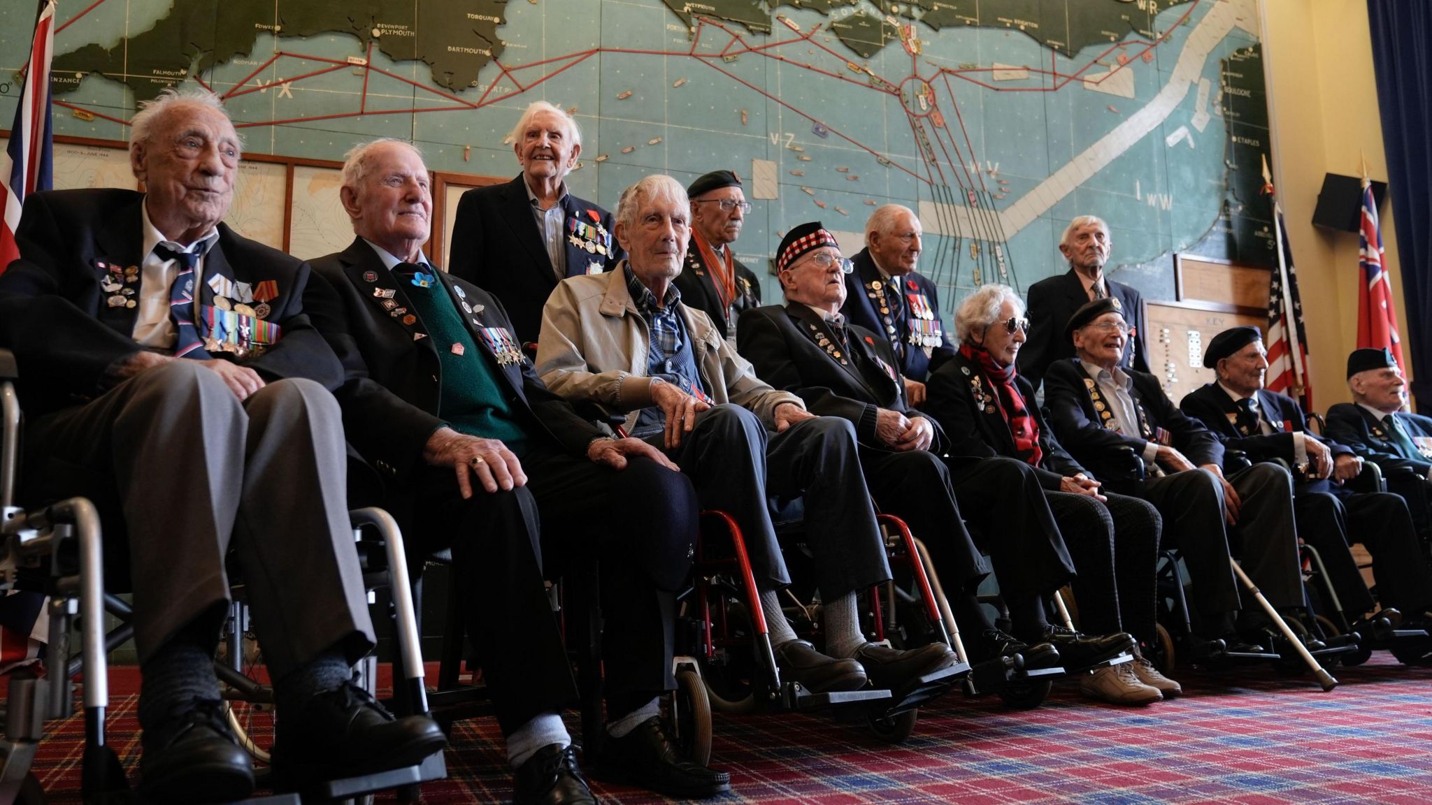 Marie Scott with other D-Day veterans in the map room of Southwick House