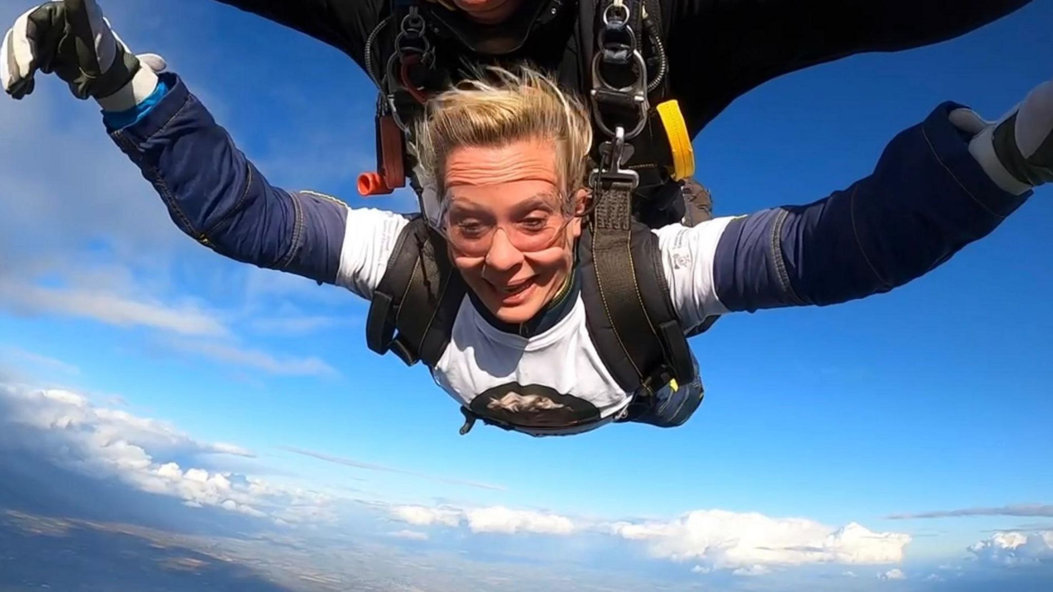 Clair Todd just out of the plane with a look of terror and joy on her face 