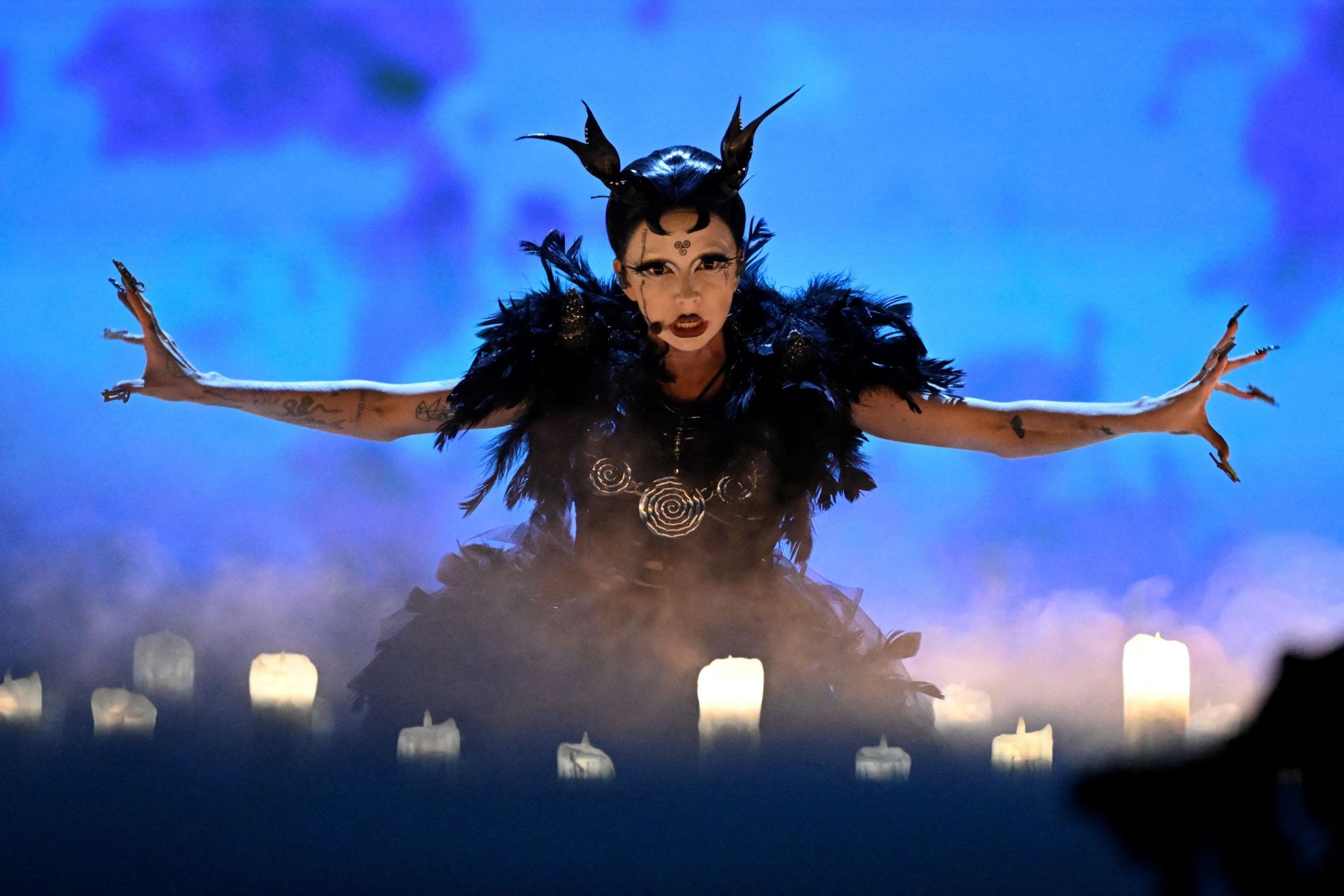 Bambie Thug performs wearing a gothic, devil horn outfit at the Eurovision Song Contest in Sweden, May 2024