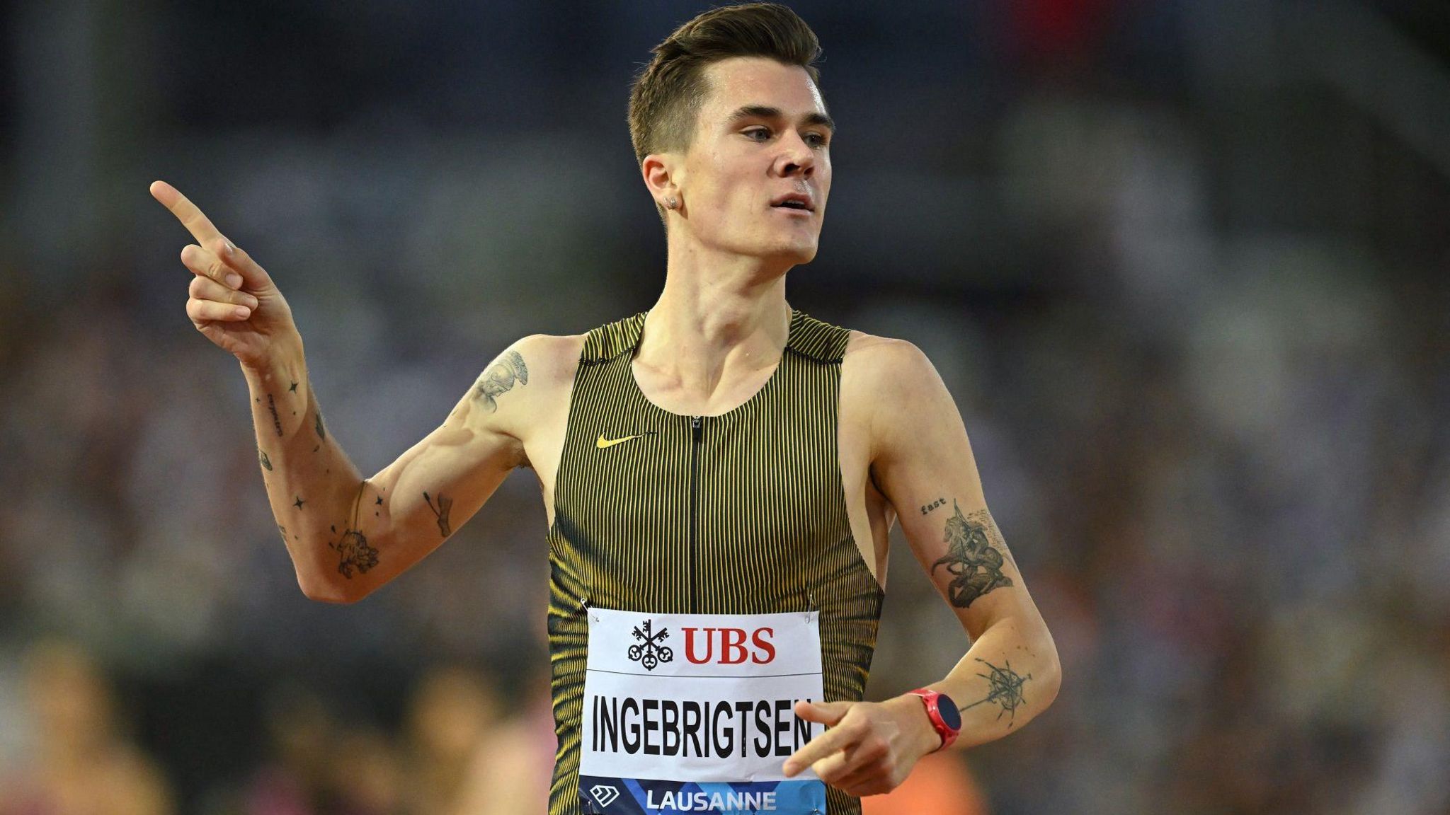 Jakob Ingebrigtsen celebrates winning the 1500m at Stade Olympique de la Pontaise in the Diamond League