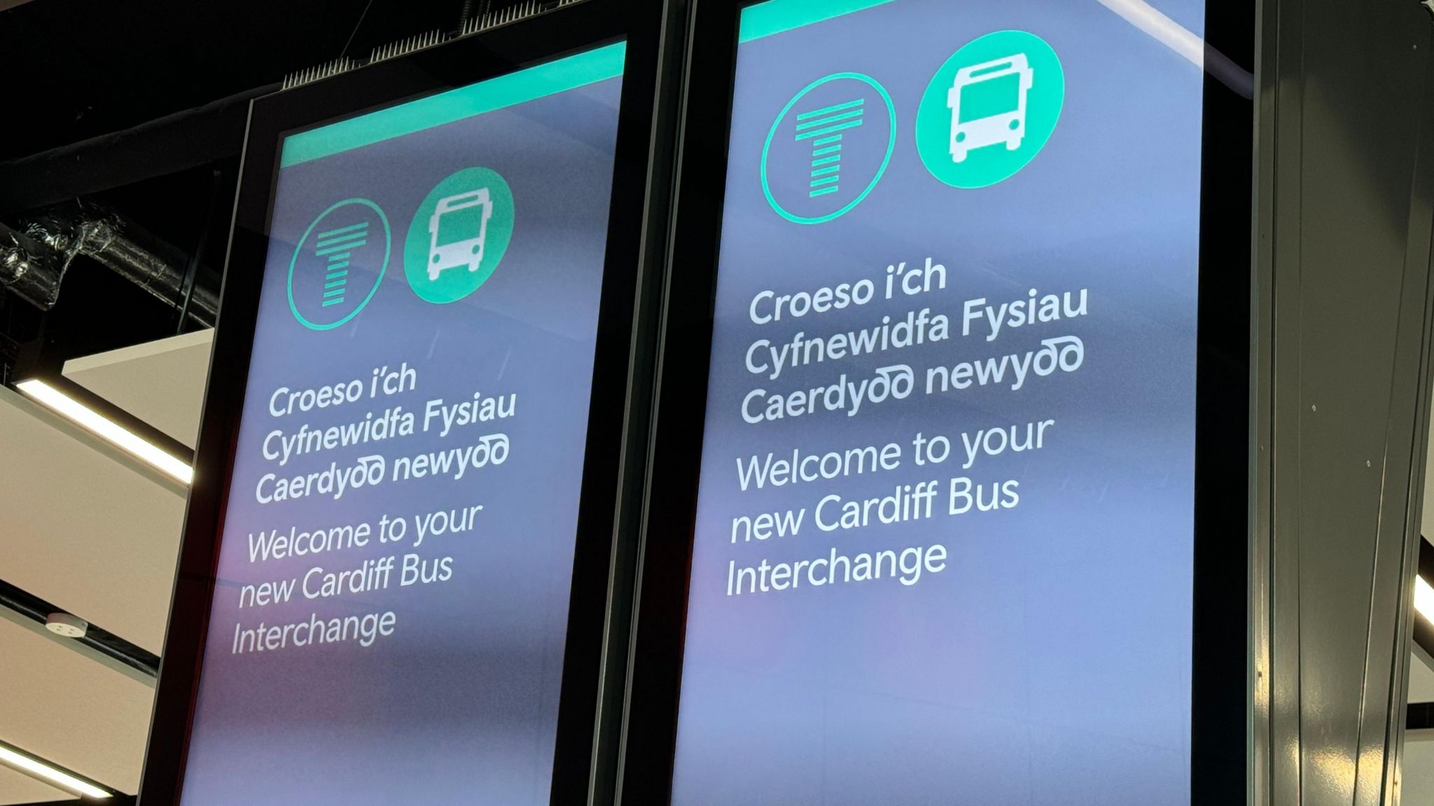 Signs inside Cardiff's new bus station read "welcome to your new Cardiff Bus Interchange"