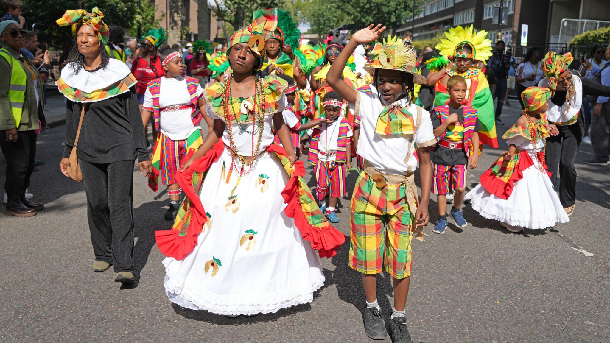 Children in costume join the parade