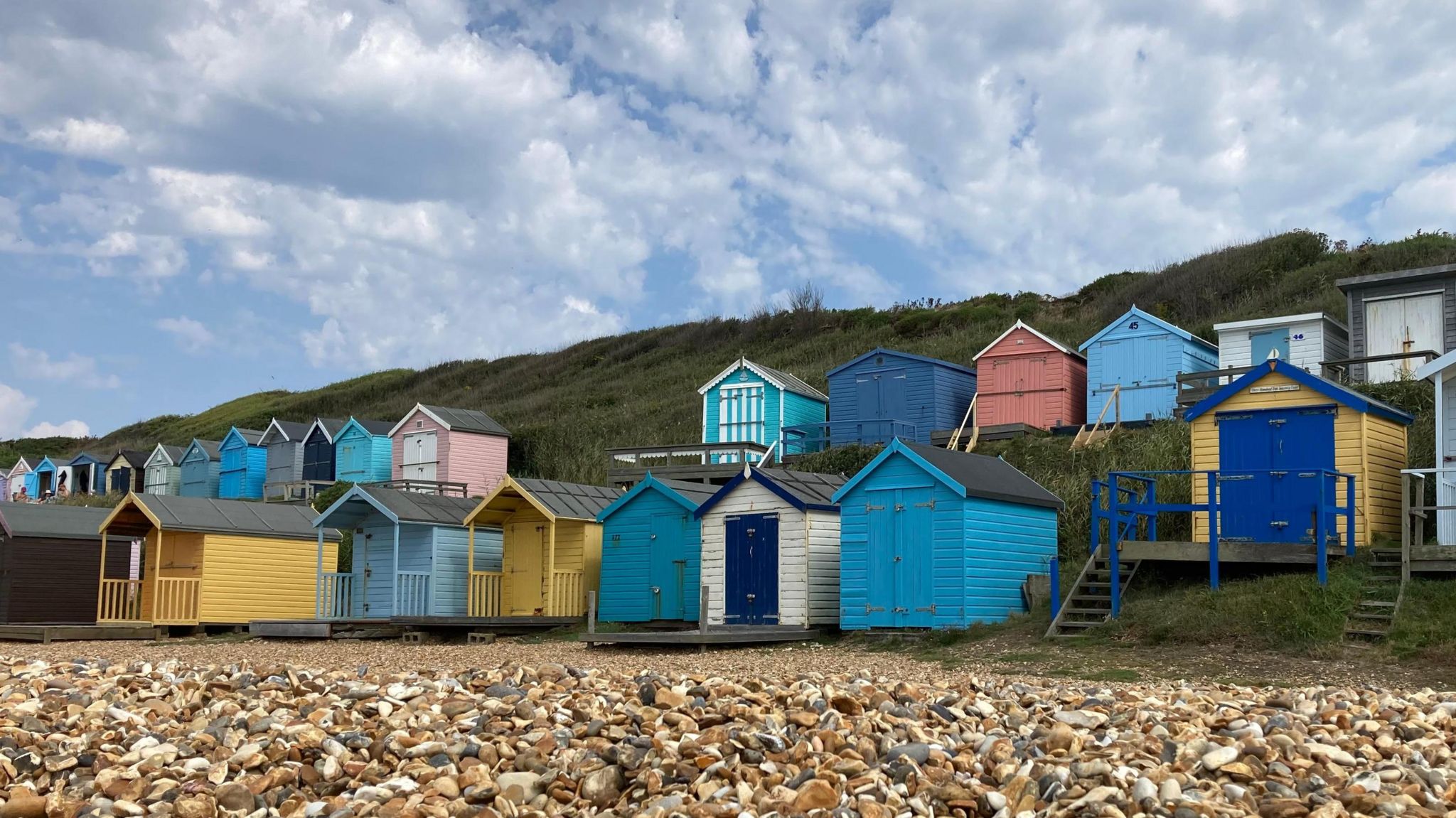 Closed up   colourful formation  huts with cloudy skies above