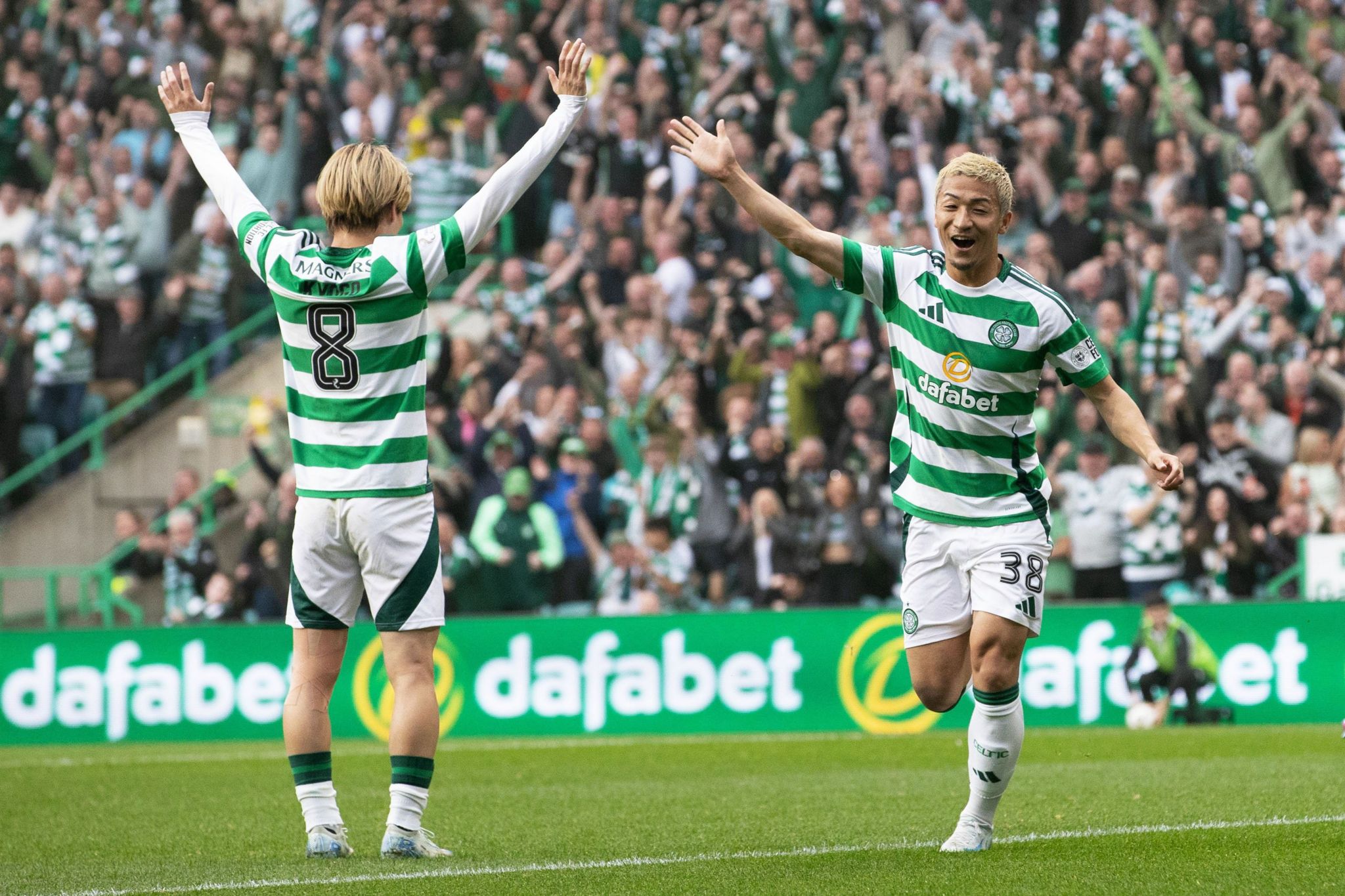 Celtic's Daizen Maeda celebrates with Kyogo Furuhashi after scoring the first goal at Celtic Park