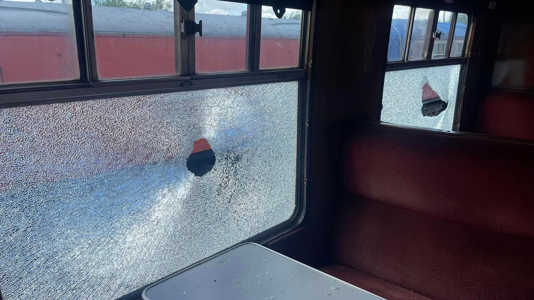 Smashed window in train carriage