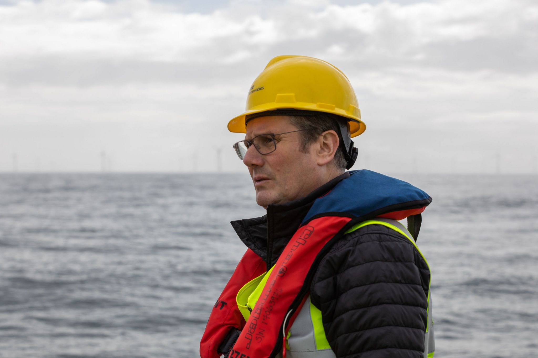 Sir Keir Starmer at sea with turbines