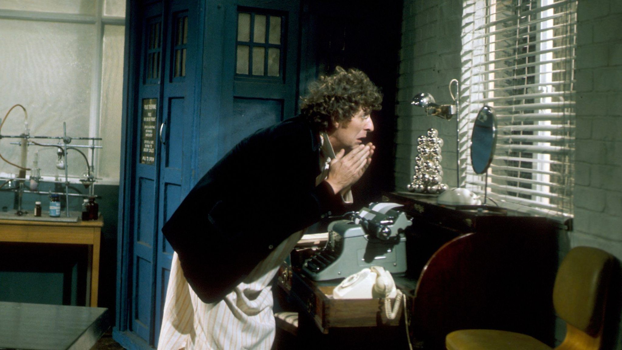 The Doctor (Tom Baker) looking into a mirror