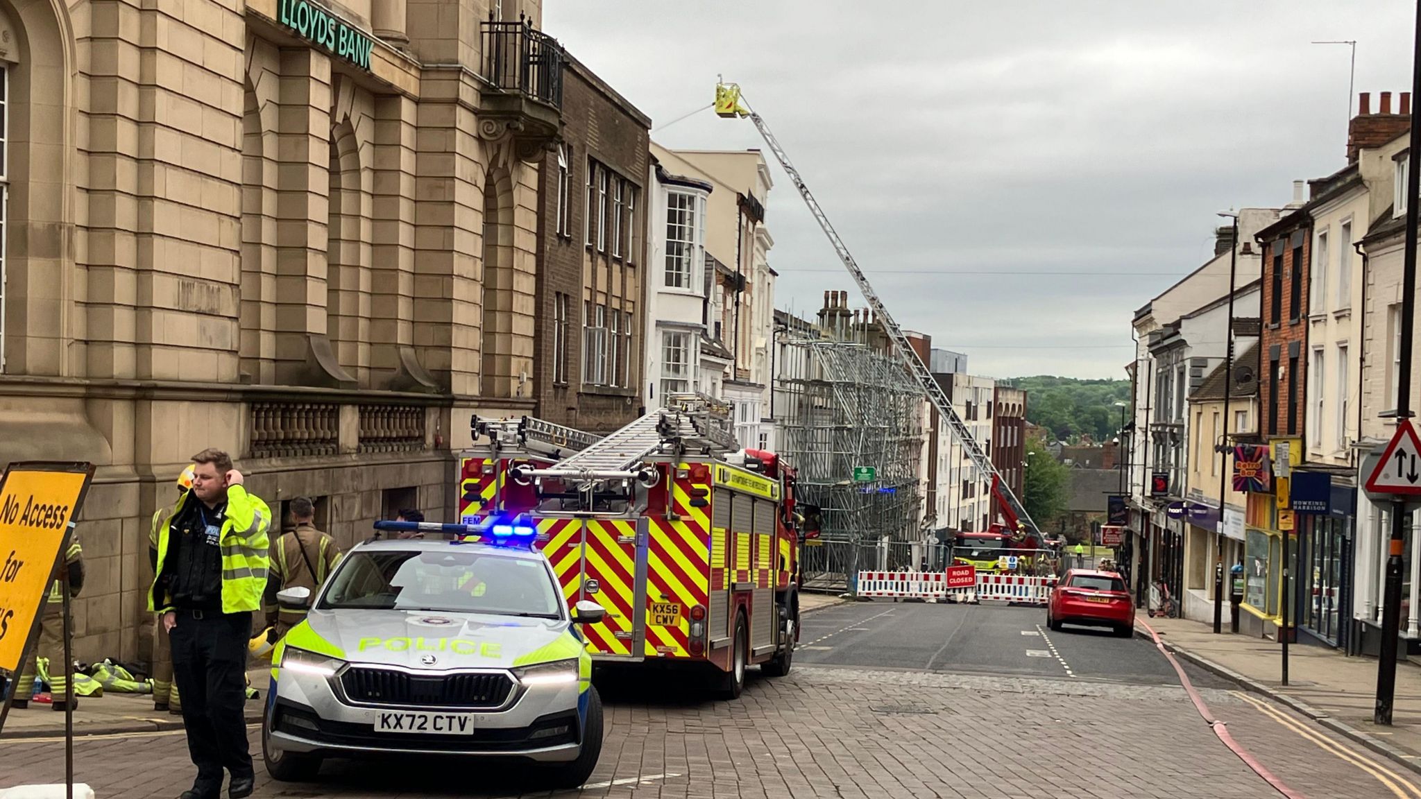 Fire engines and police car on Bridge Street in Northampton after a fire