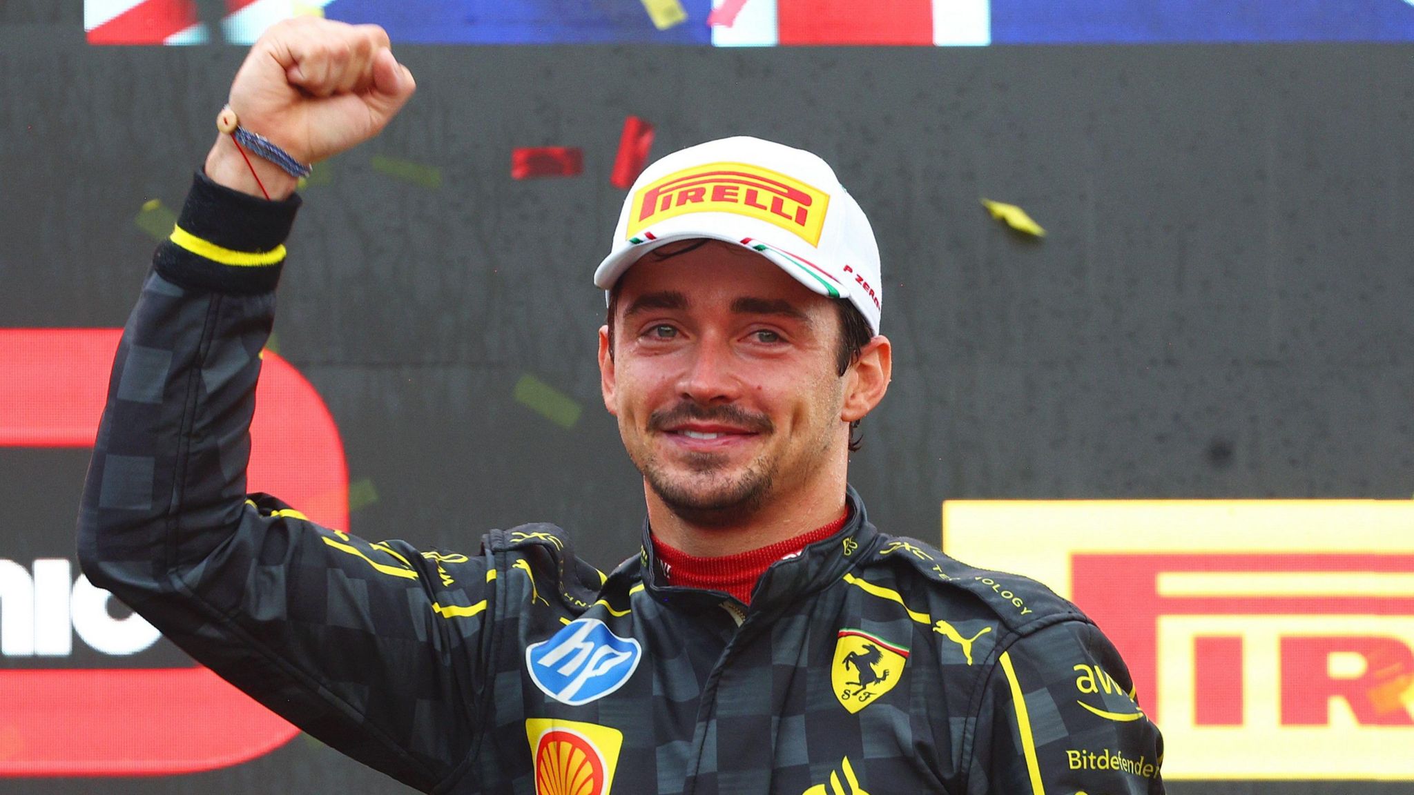 An emotional Charles Leclerc celebrates on the podium