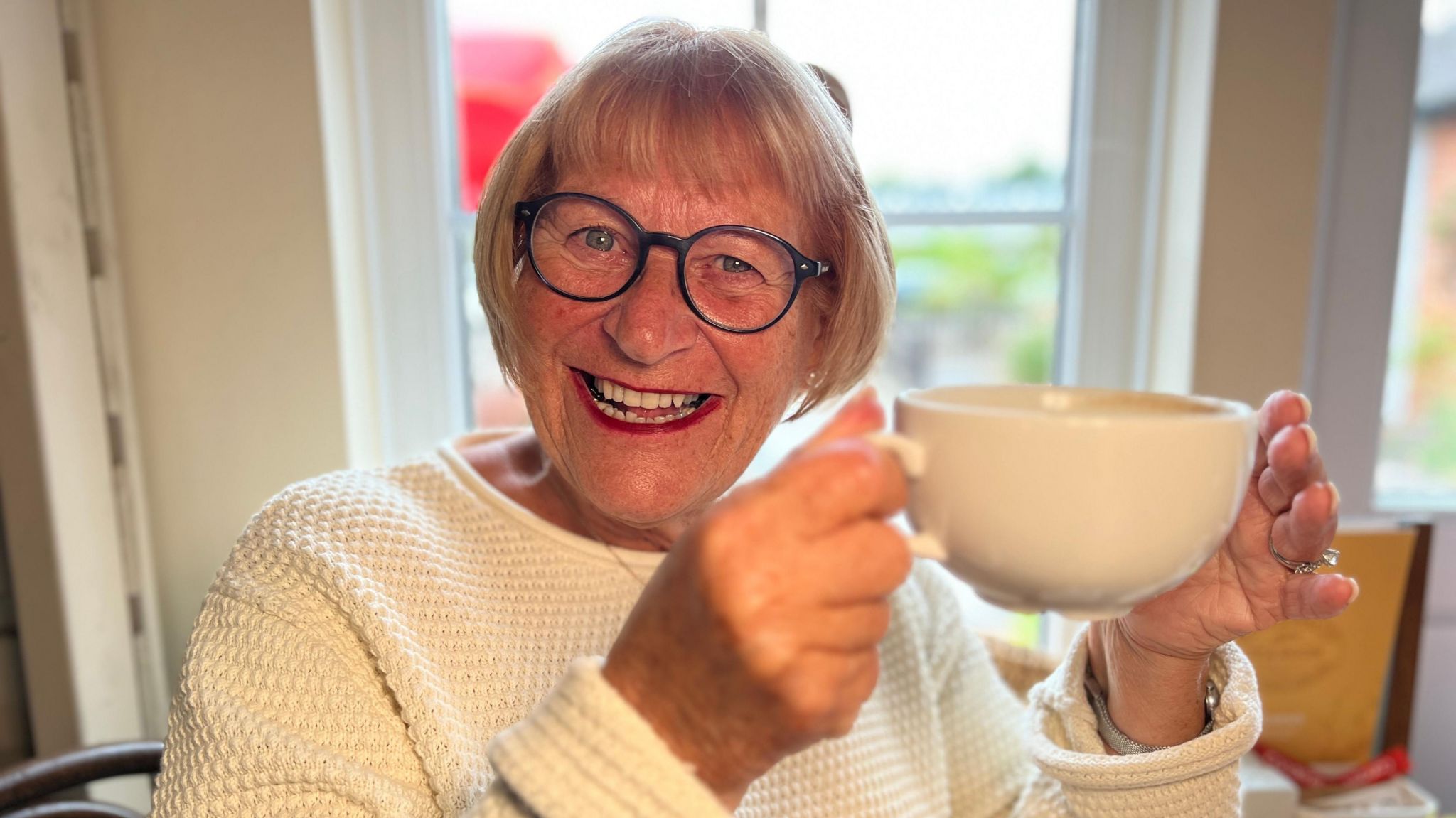 Ann Weymouth with coffee cup